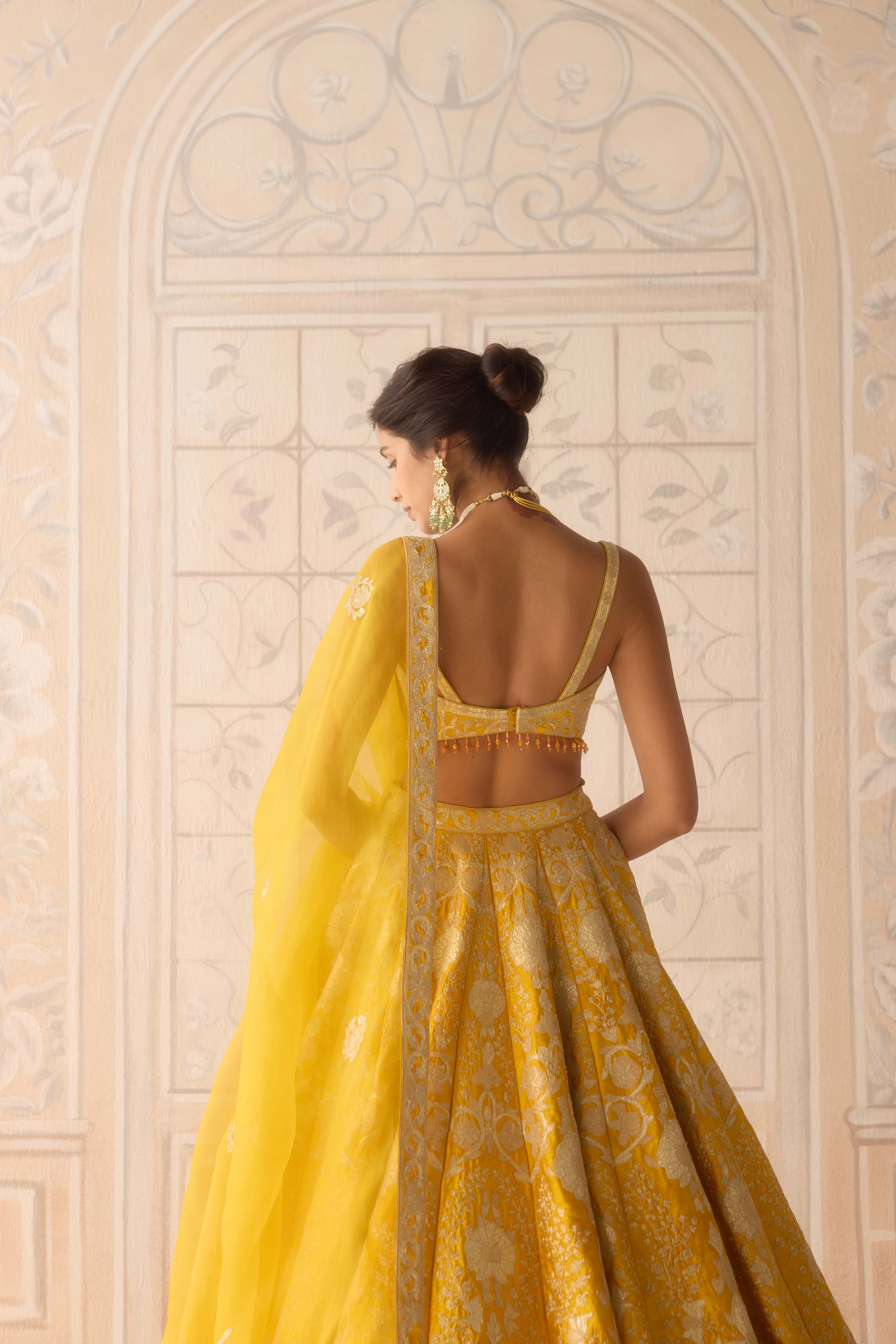 Raw silk dandelion yellow gold applique and thread embroidered lehenga set with organza dupatta
