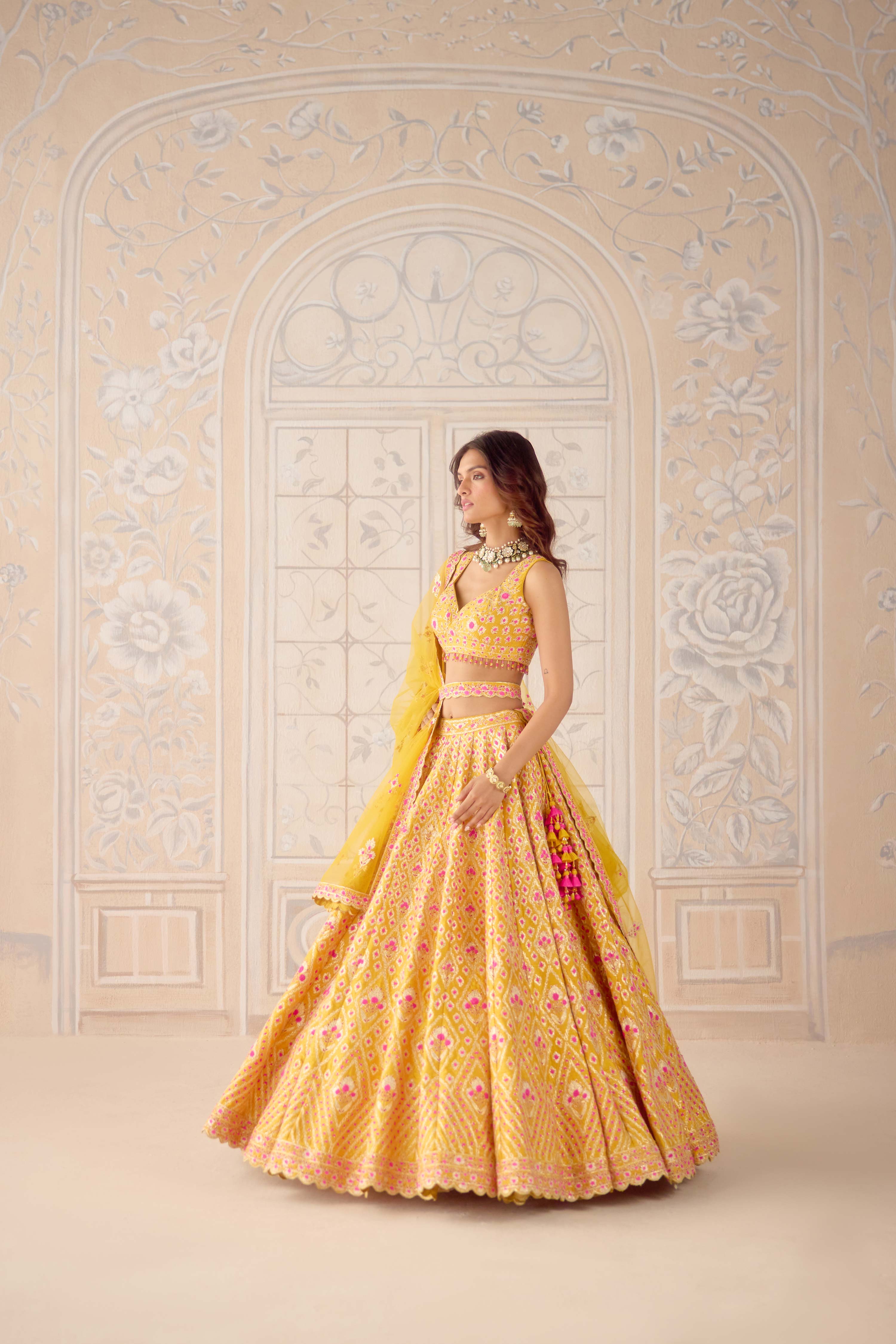 Raw silk mustard yellow gota and theread embroidered lehenga set