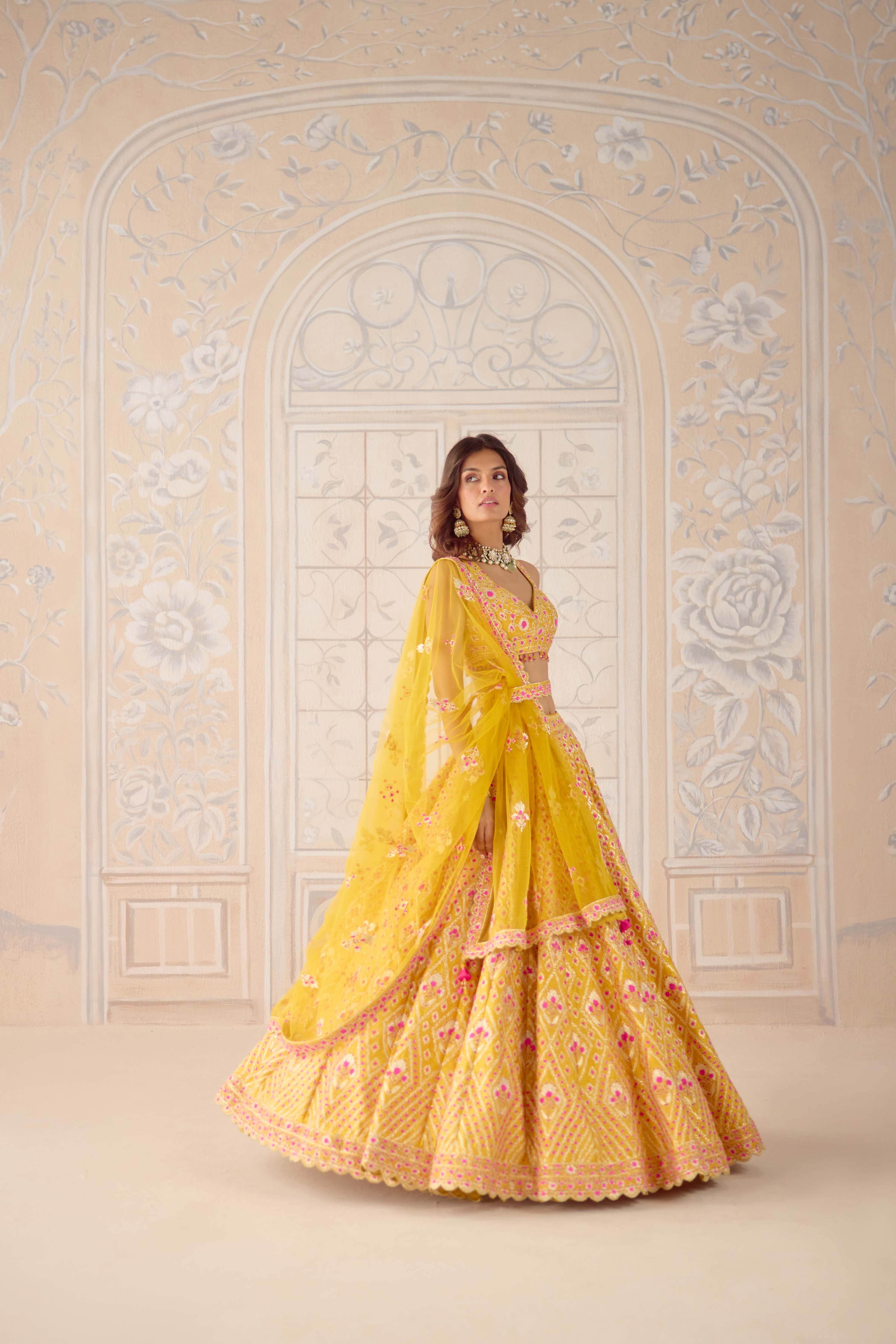 Raw silk mustard yellow gota and theread embroidered lehenga set