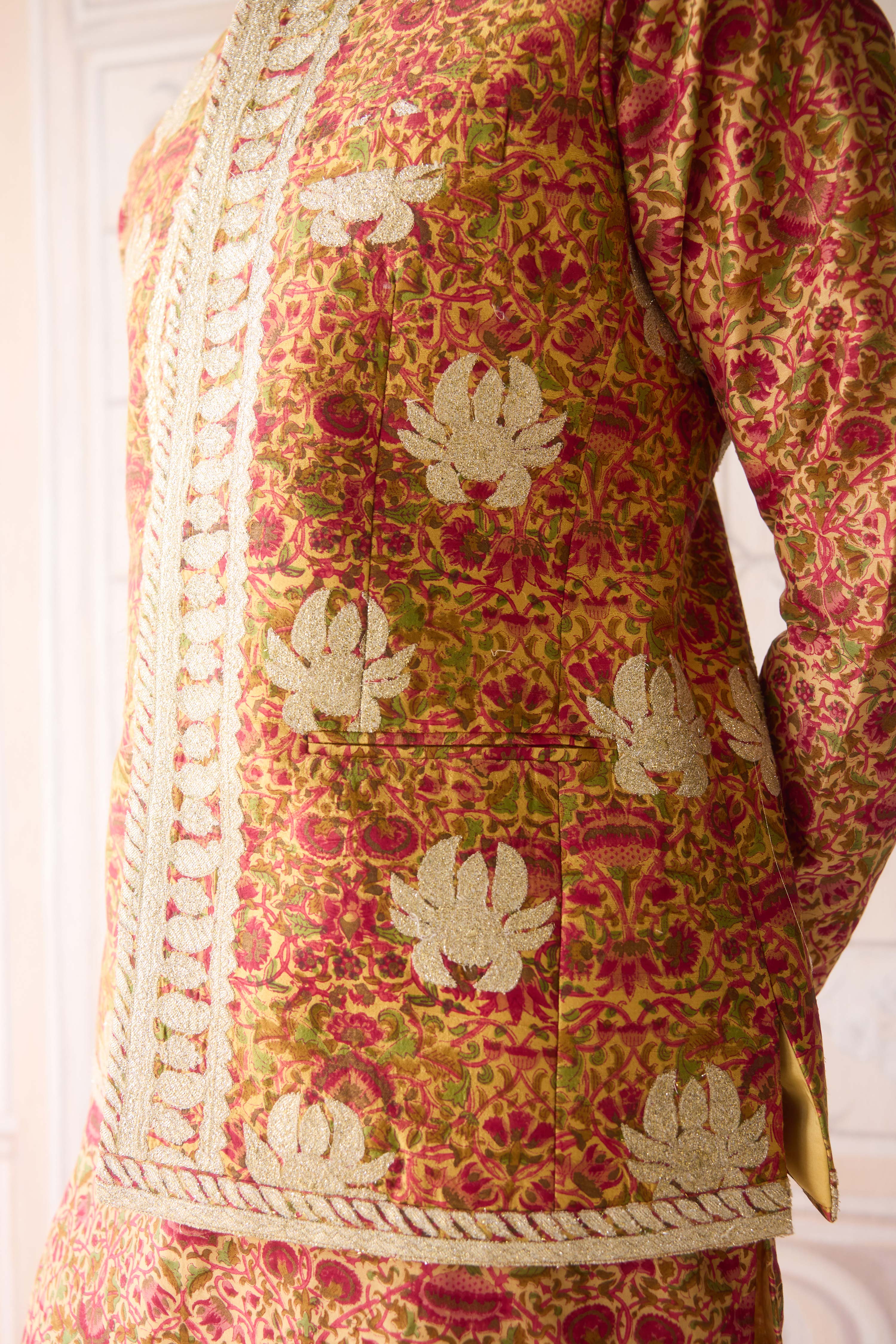 Handblock printed gold applique and thread embroidered kurta paired with embroidered raw silk waist coat