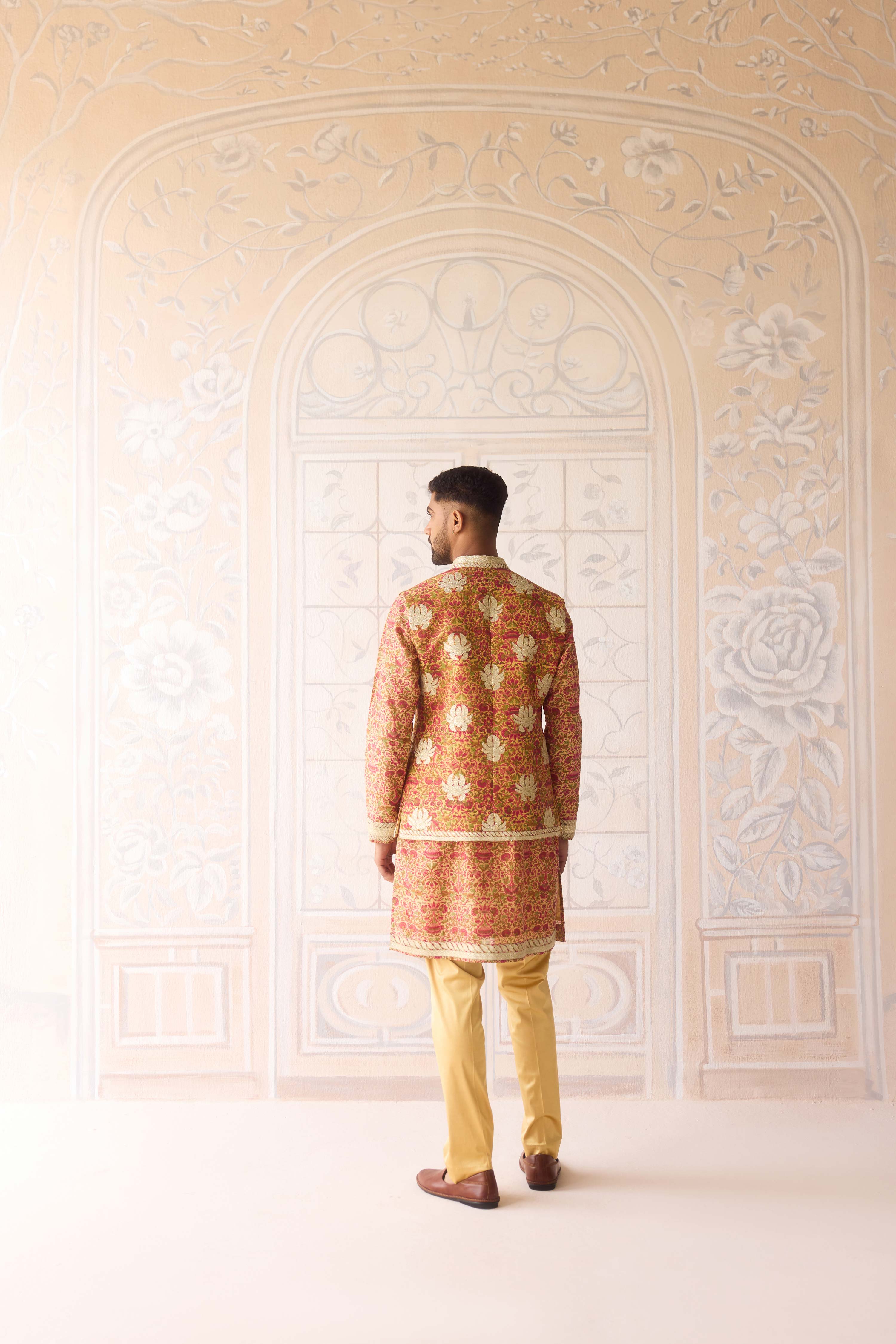 Handblock printed gold applique and thread embroidered kurta paired with embroidered raw silk waist coat