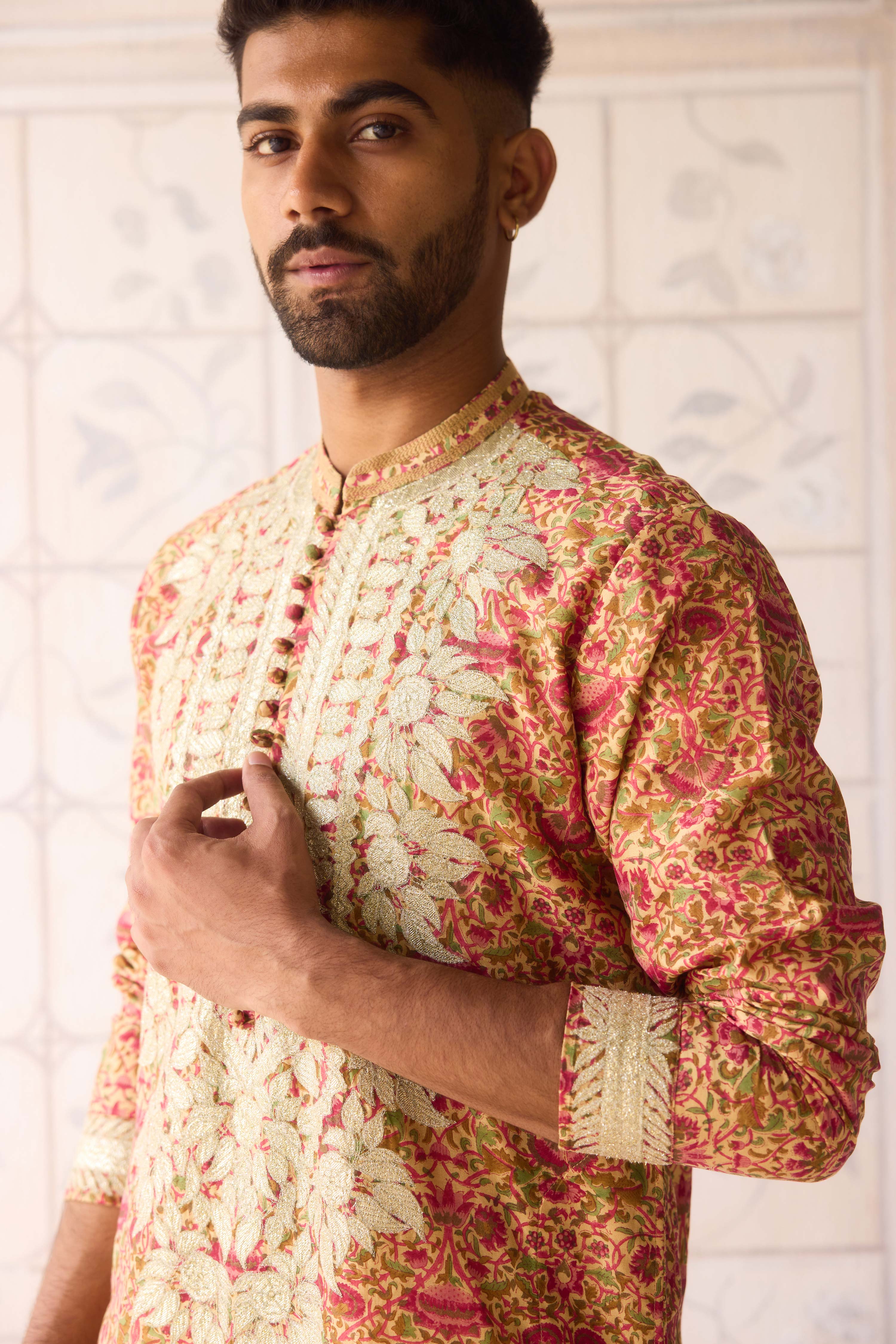 Handblock printed gold applique and thread embroidered kurta paired with embroidered raw silk waist coat