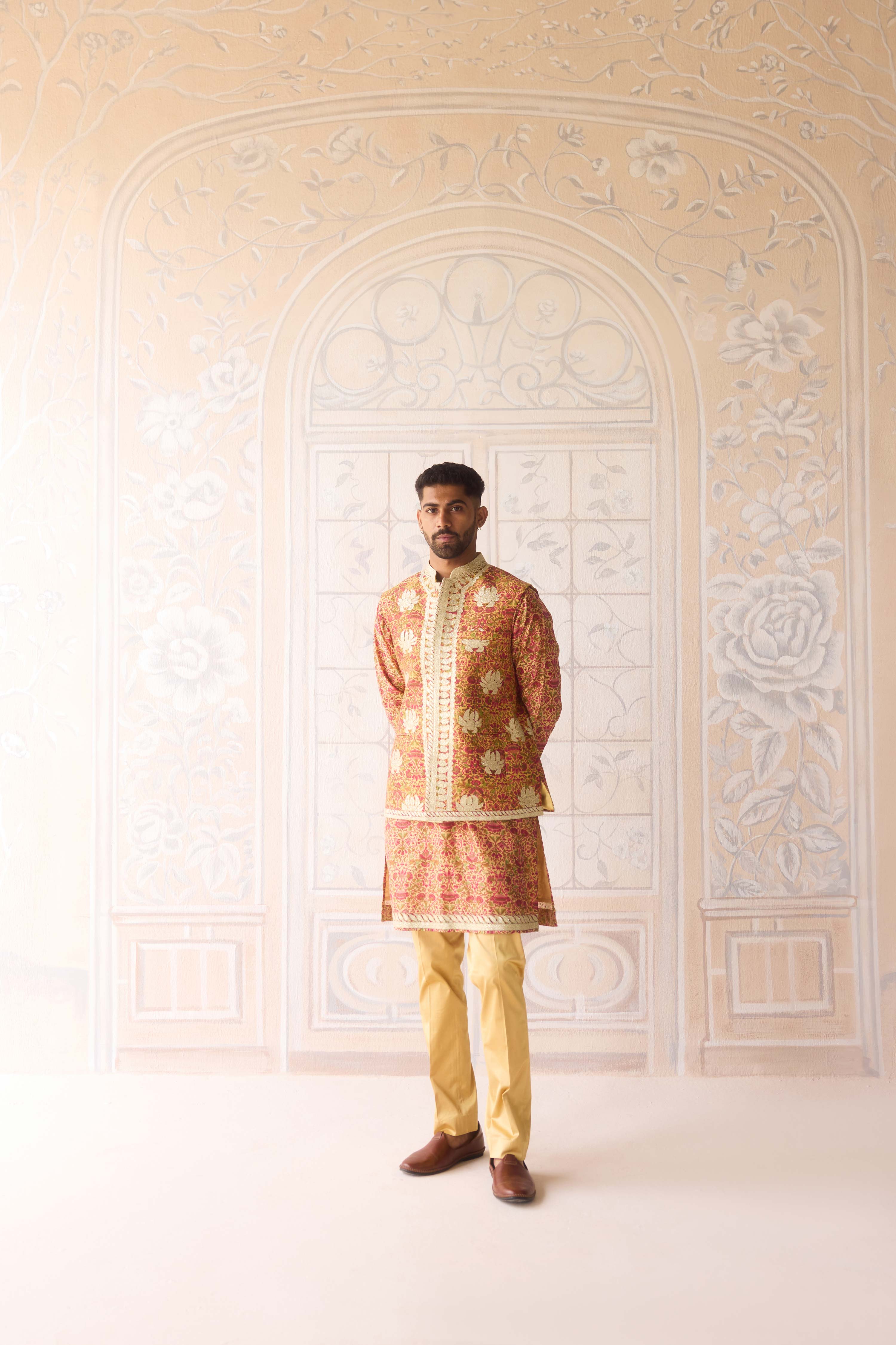 Handblock printed gold applique and thread embroidered kurta paired with embroidered raw silk waist coat