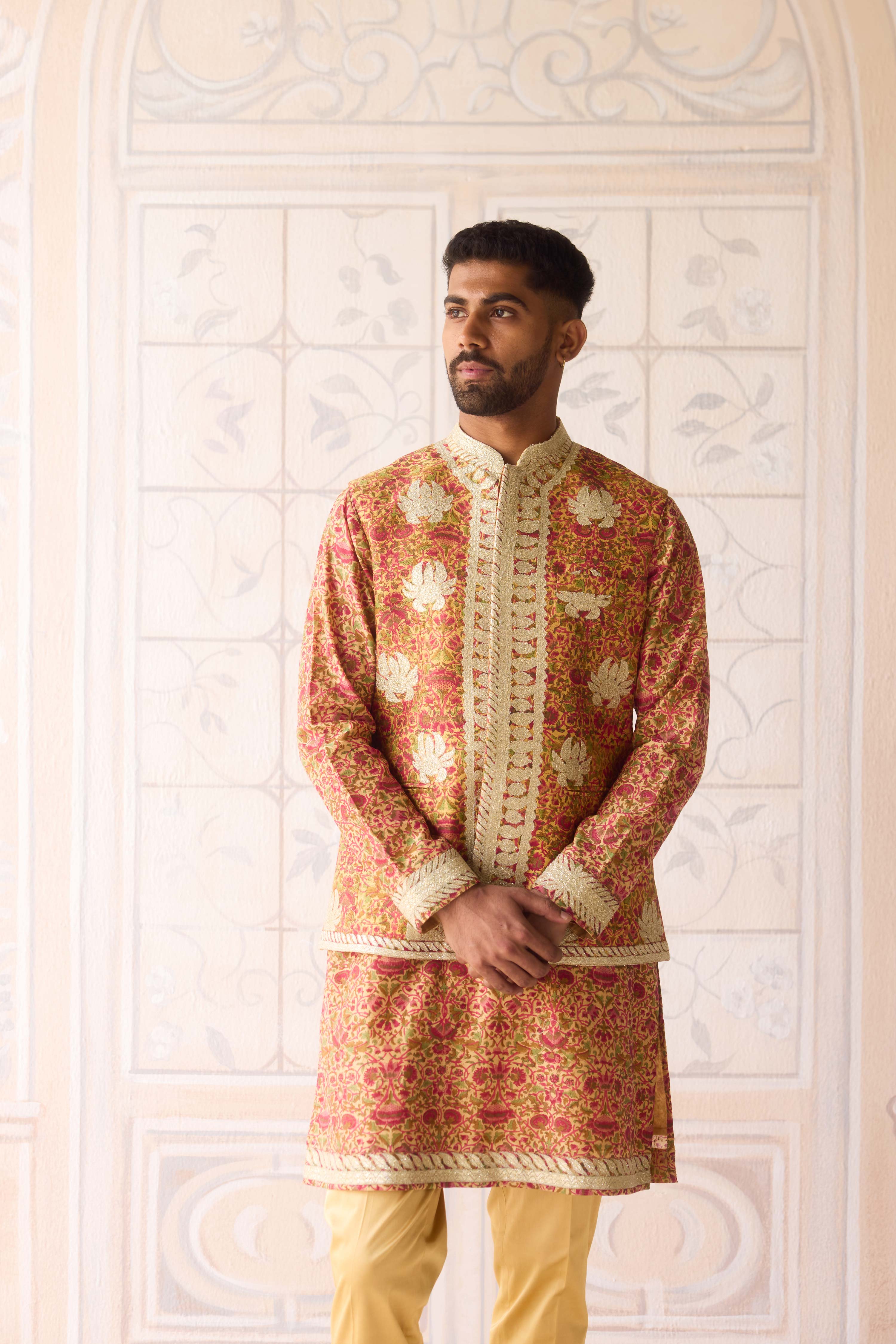 Handblock printed gold applique and thread embroidered kurta paired with embroidered raw silk waist coat