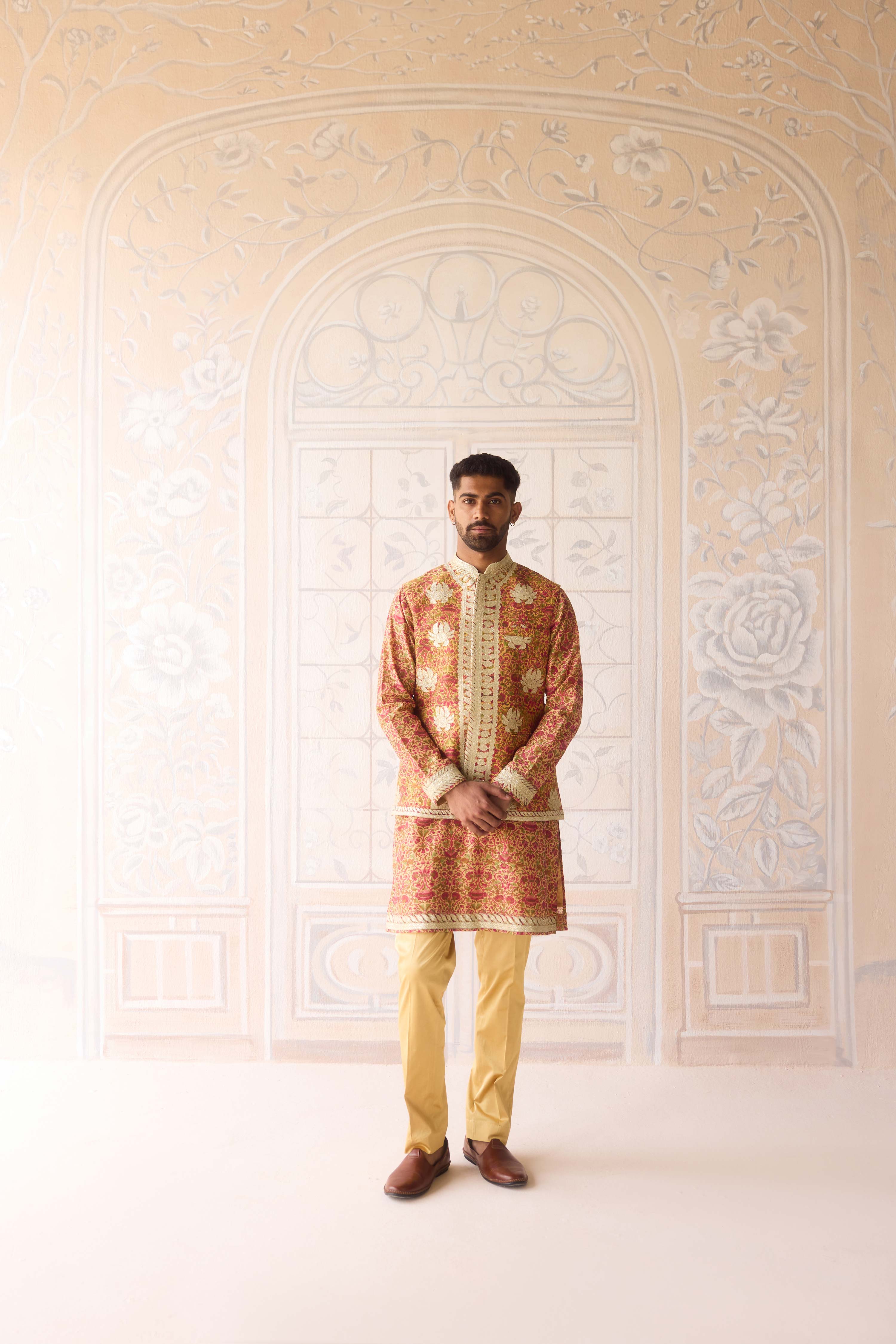 Handblock printed gold applique and thread embroidered kurta paired with embroidered raw silk waist coat