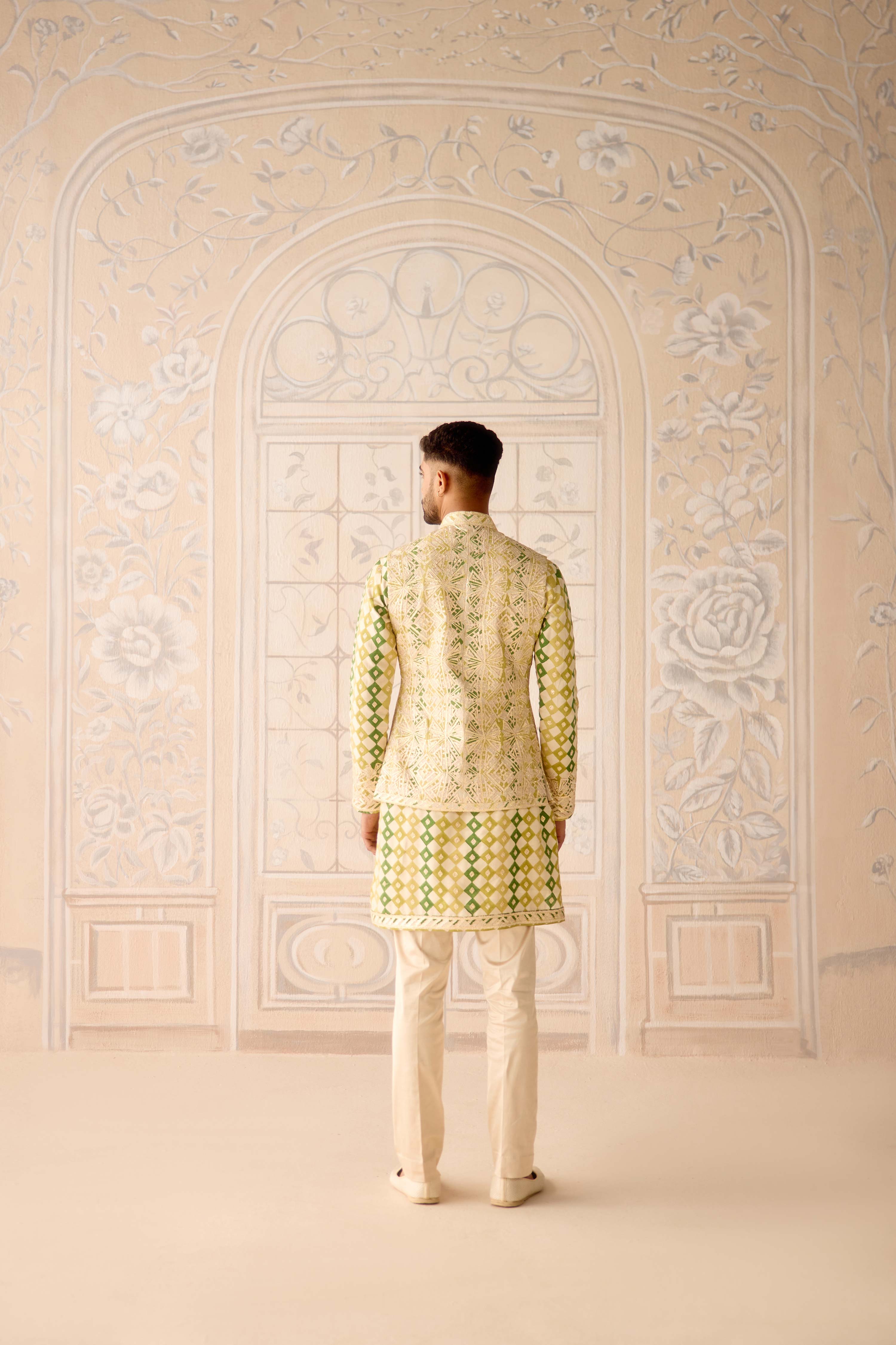 Hand block printed gold dori and thread embroidered chanderi kurta paired with fully embroidered raw silk waist coat