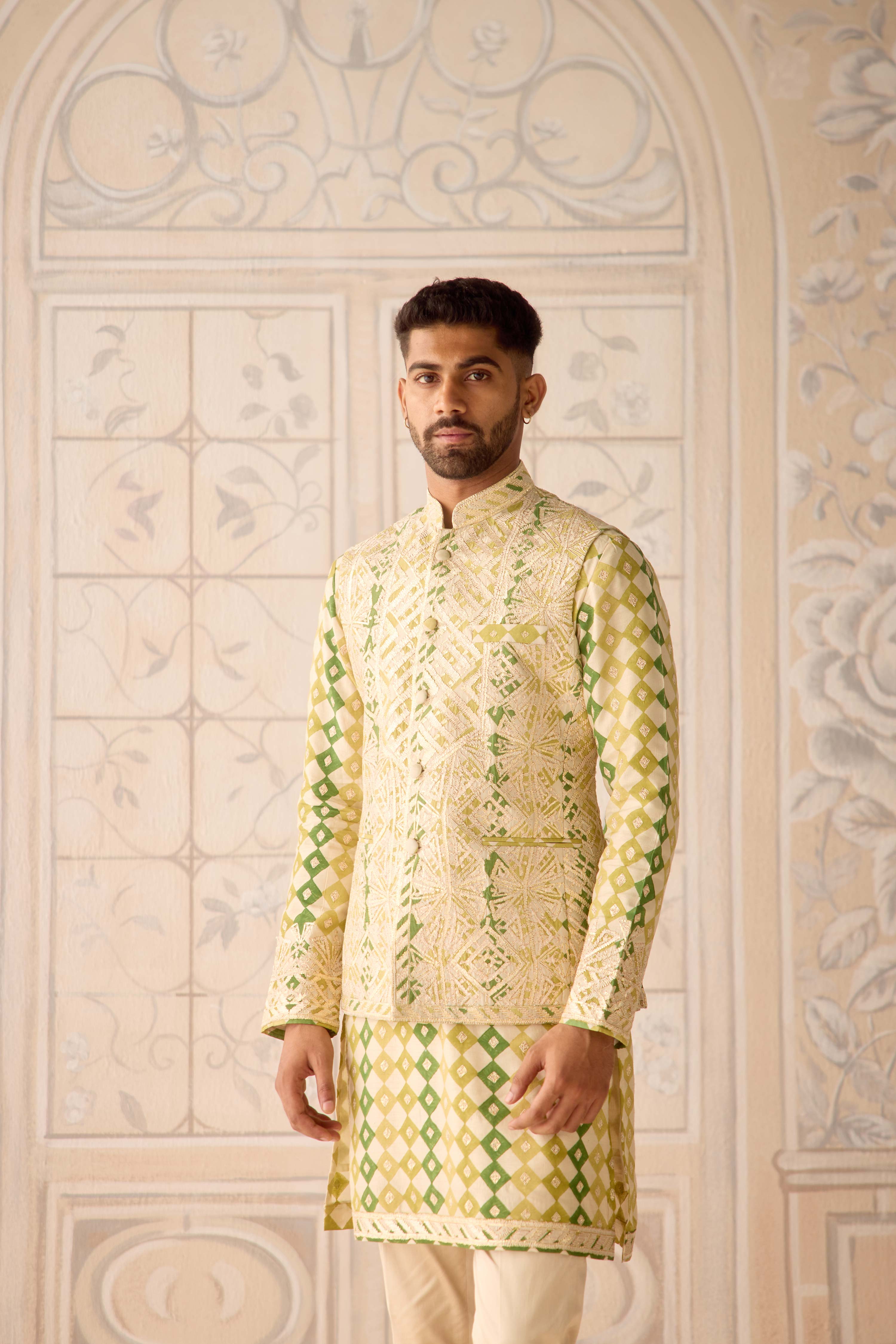 Hand block printed gold dori and thread embroidered chanderi kurta paired with fully embroidered raw silk waist coat