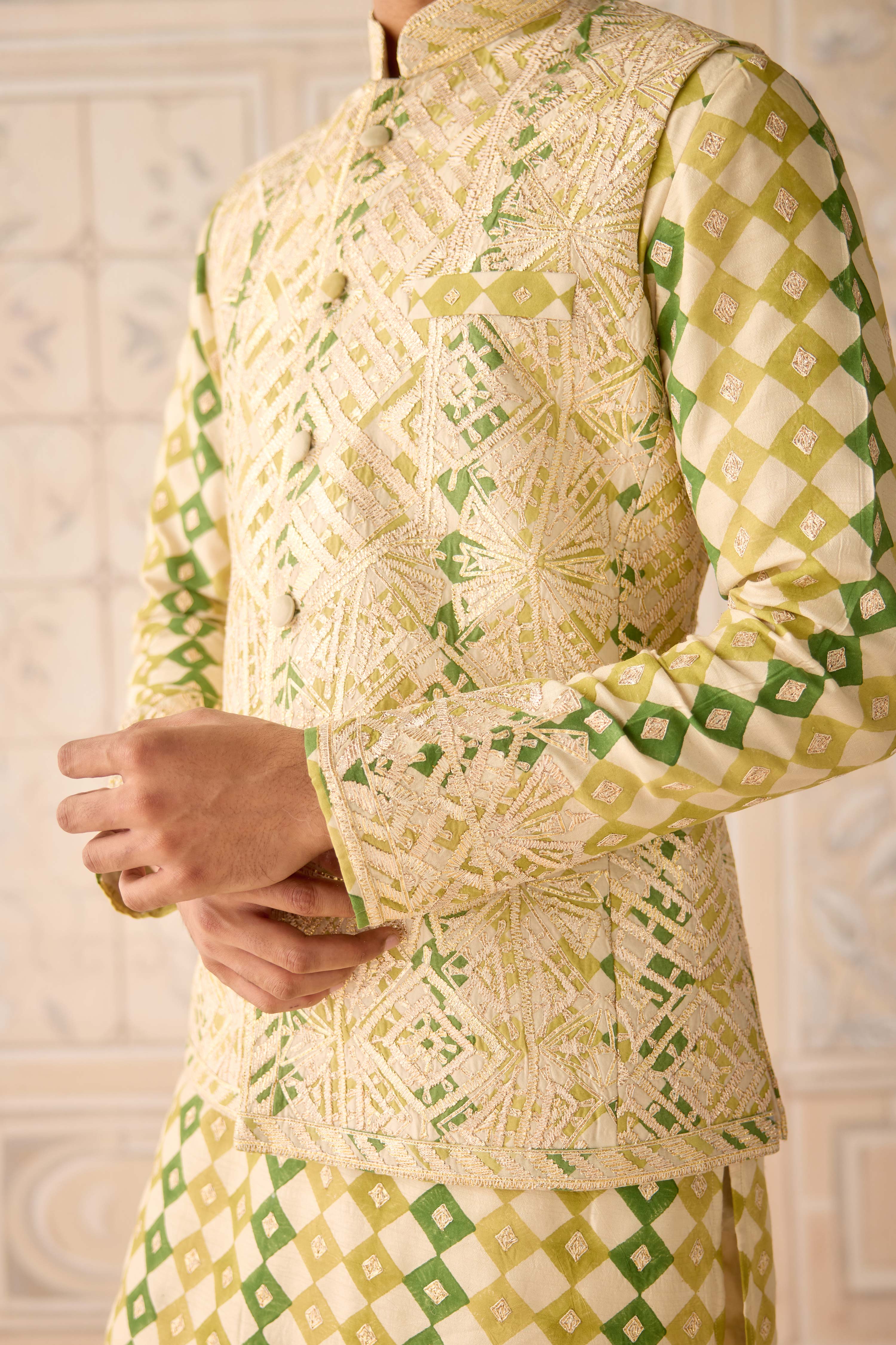 Hand block printed gold dori and thread embroidered chanderi kurta paired with fully embroidered raw silk waist coat