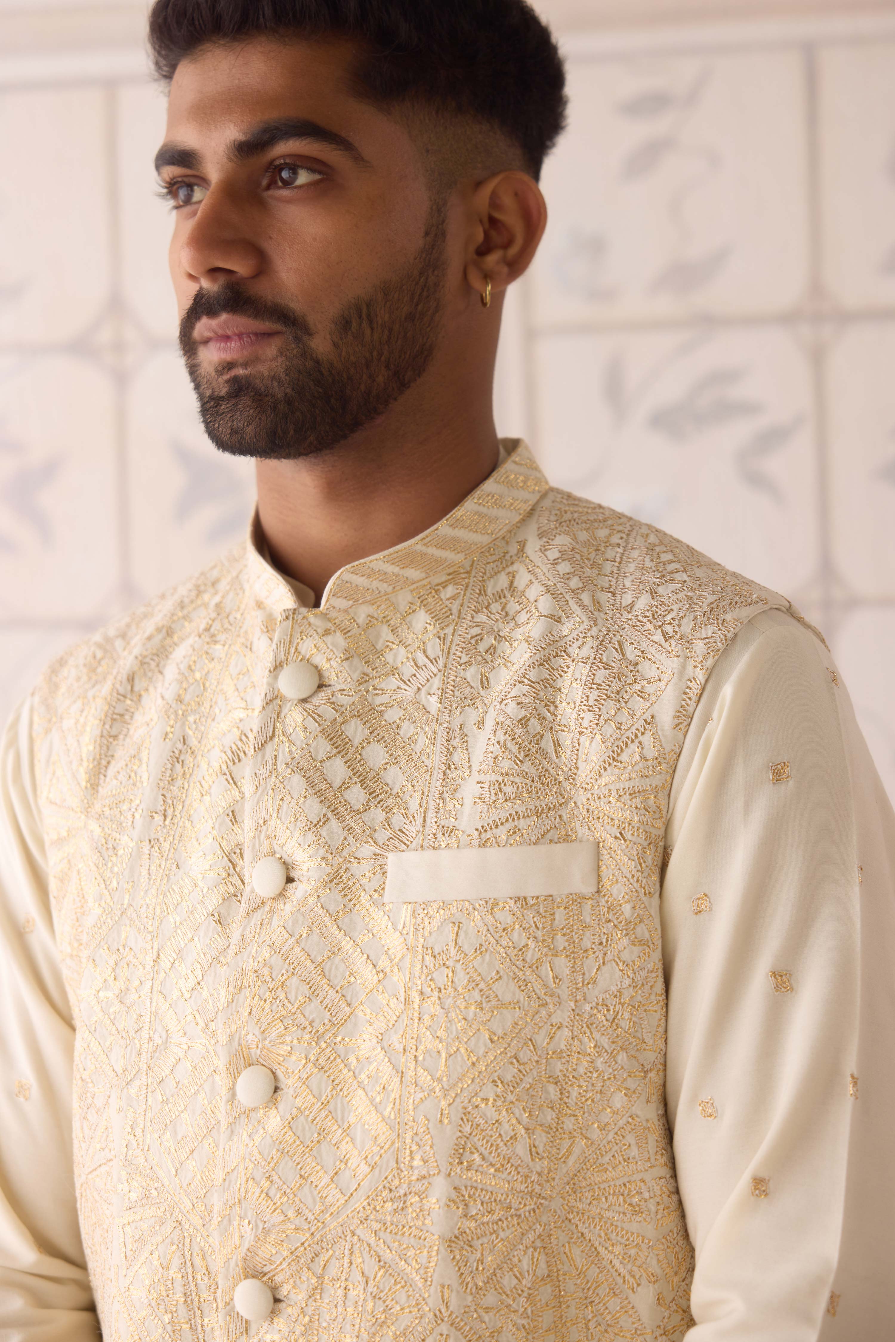 Egret ivory cotton silk gold and thread embroidereed kurta paired with fully embroidered waistcoat
