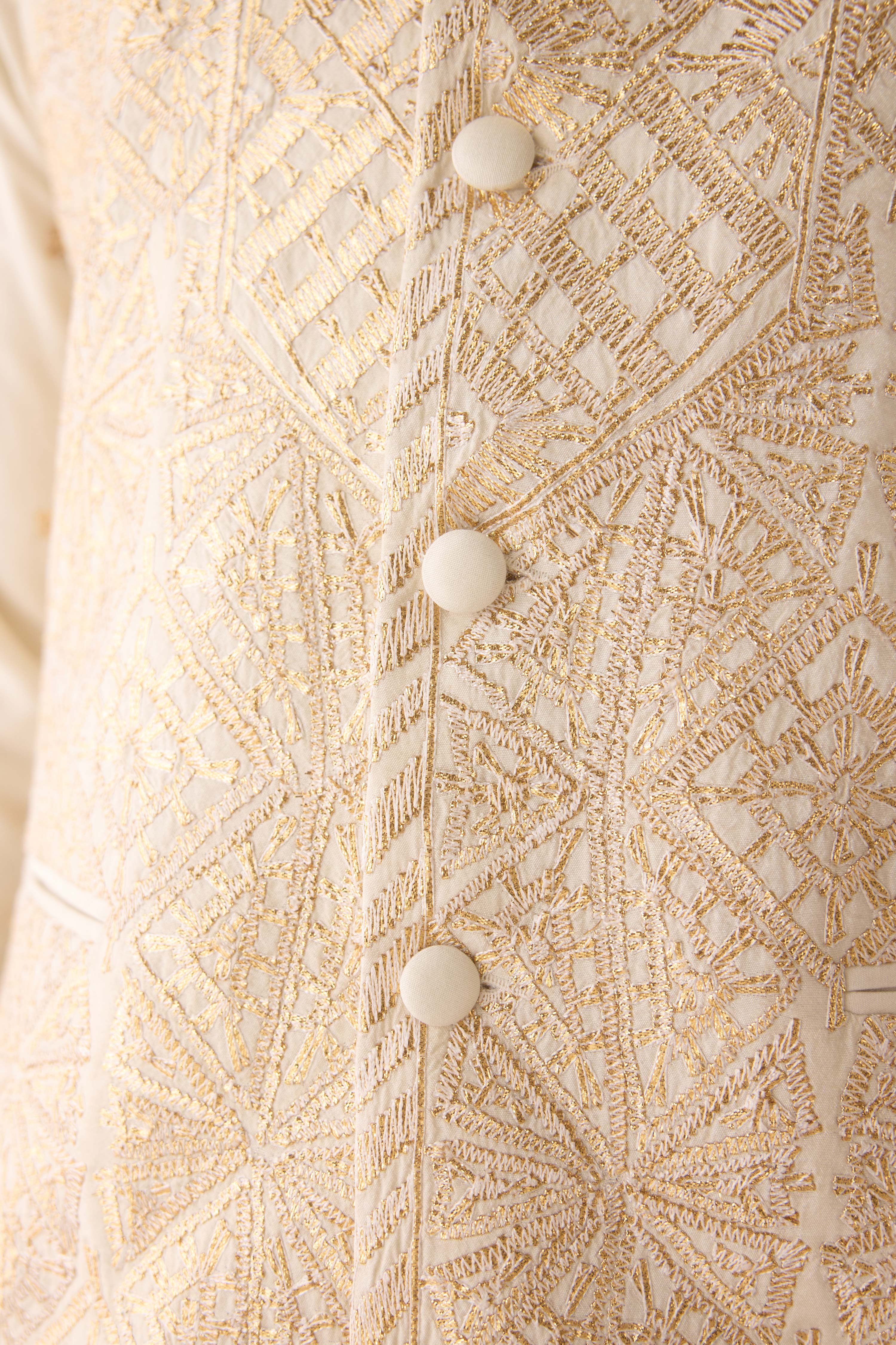 Egret ivory cotton silk gold and thread embroidereed kurta paired with fully embroidered waistcoat