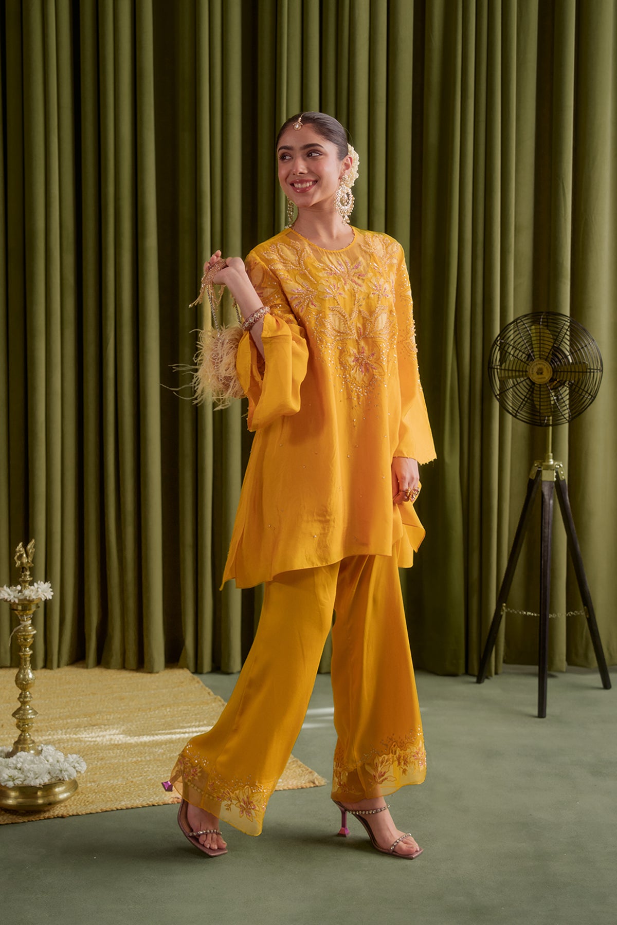 Golden yellow co-ord set with embroidered magnolia flower pattern.