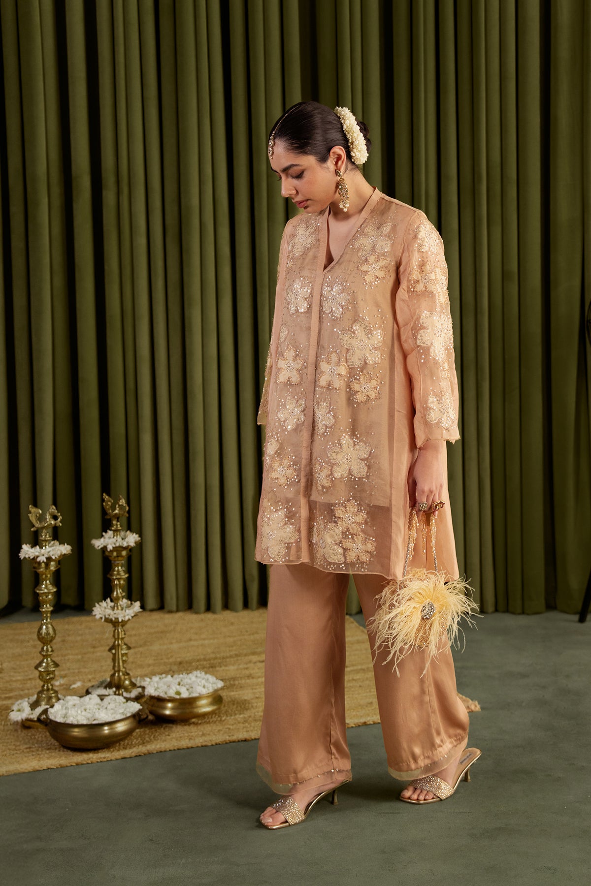 Golden beige co-ord set with embroidered floral pattern.