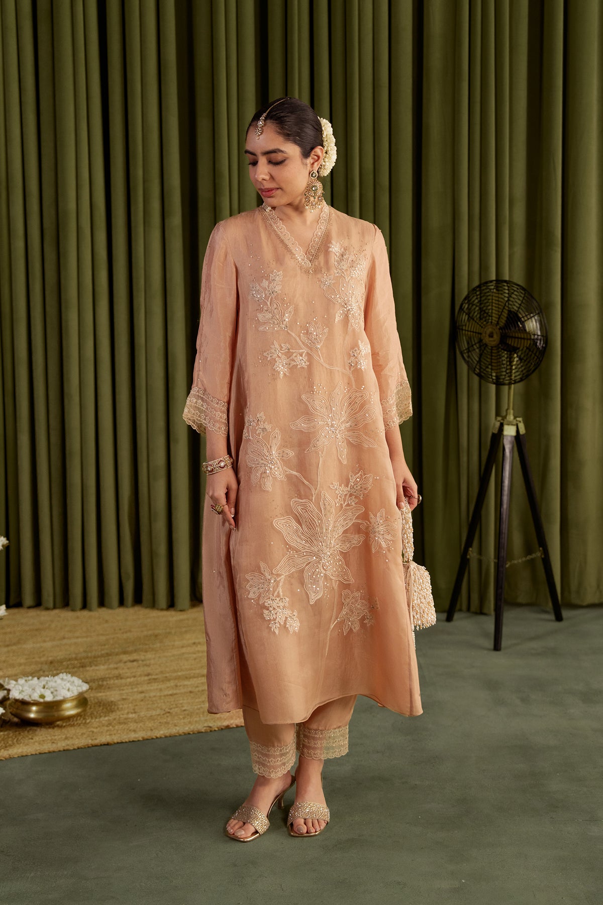 Golden beige kurta set with delicate floral embroidery.