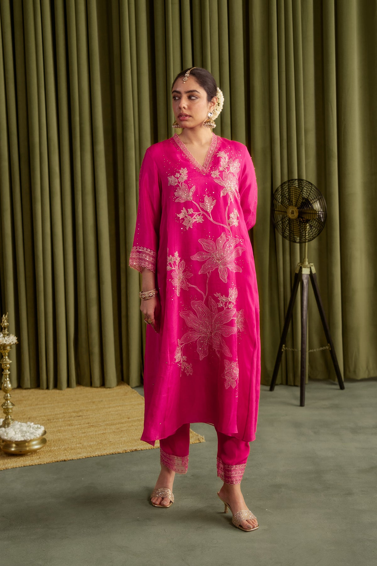 Hot pink kurta set with delicate floral embroidery.