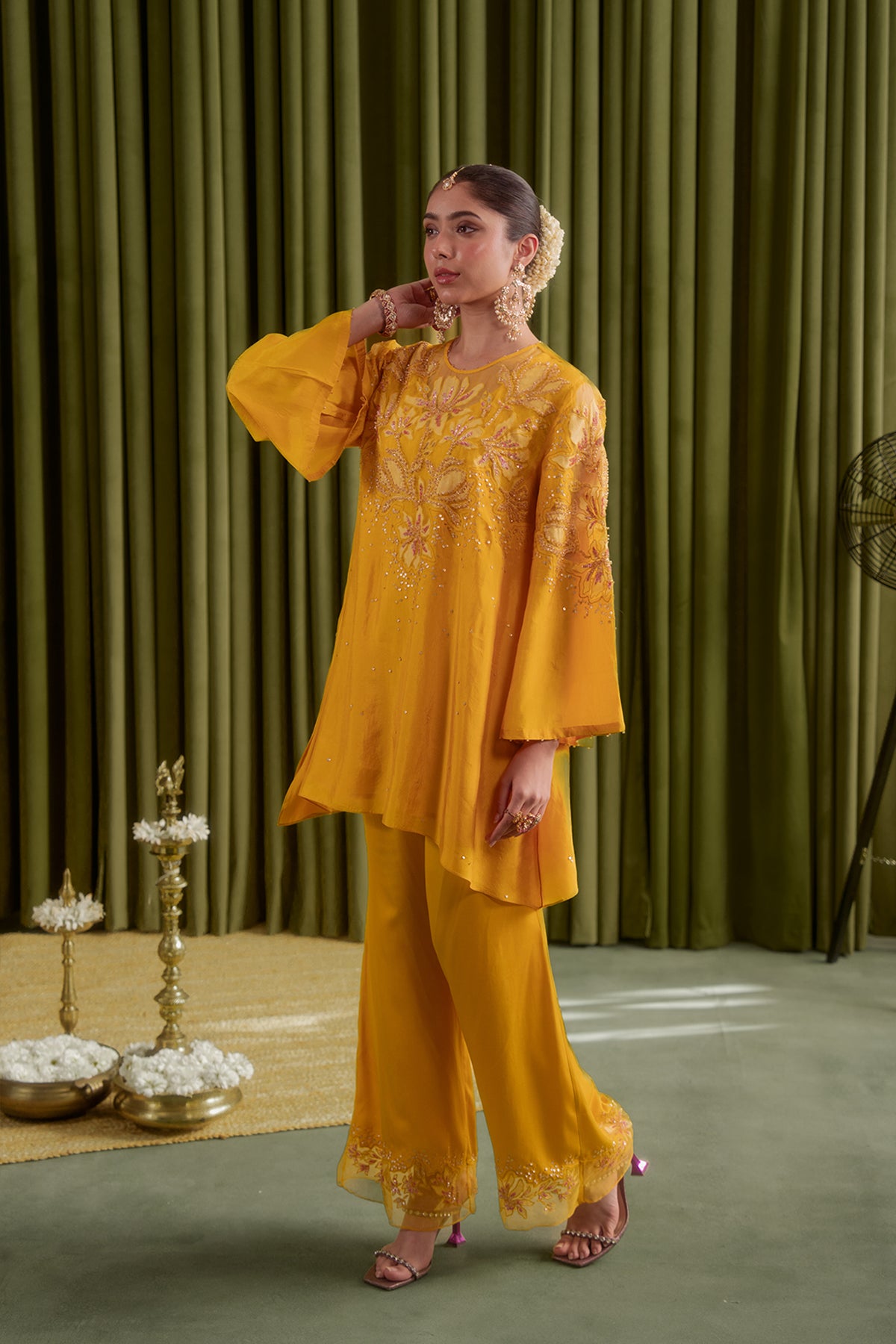 Golden yellow co-ord set with embroidered magnolia flower pattern.