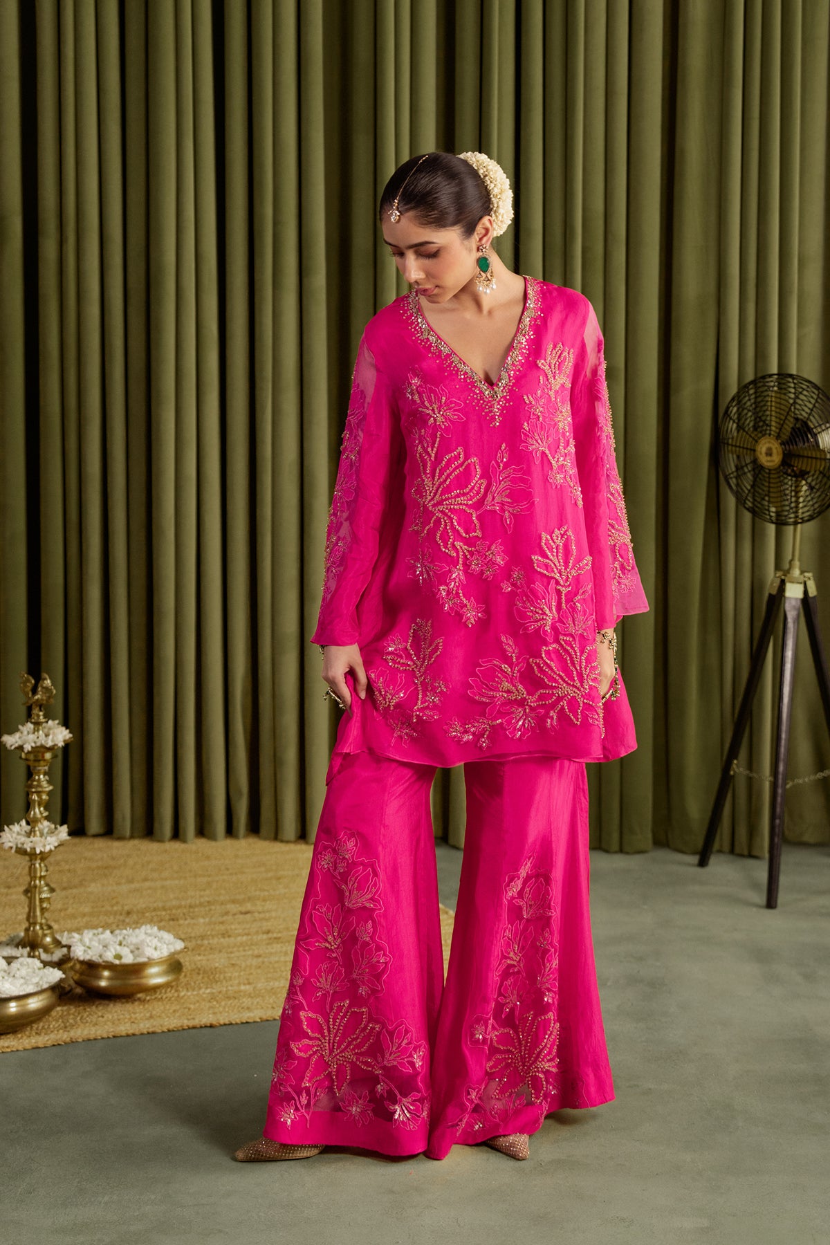 Hot pink sharara set with embroidered magnolia flower pattern.