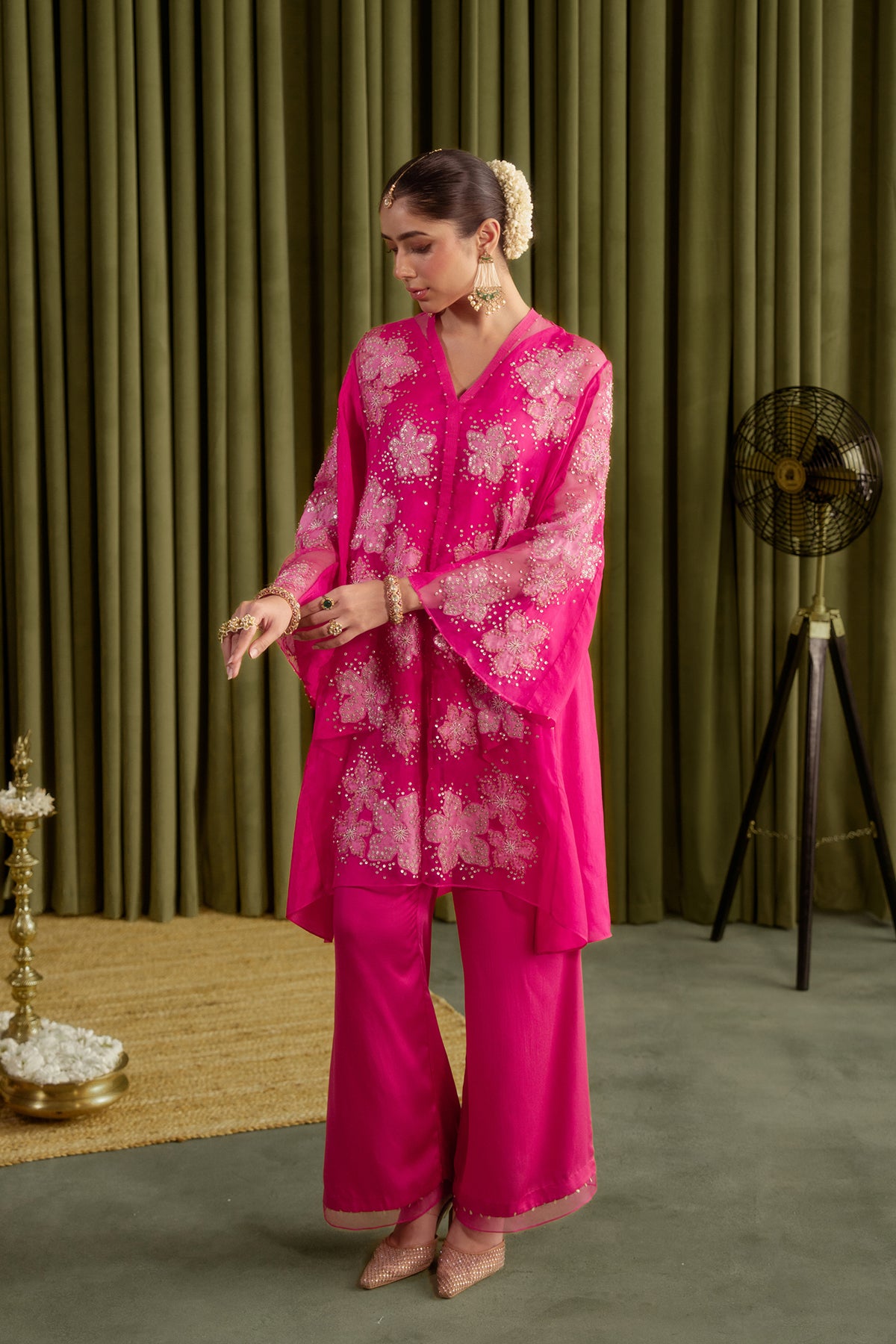 Hot pink co-ord set with embroidered floral pattern.