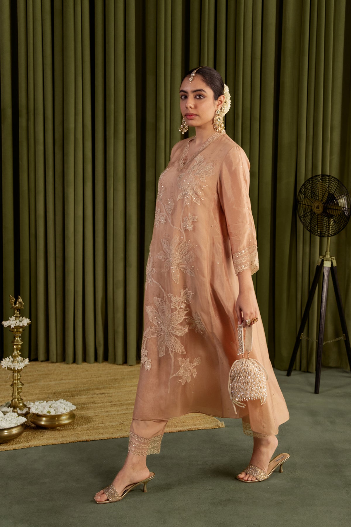 Golden beige kurta set with delicate floral embroidery.