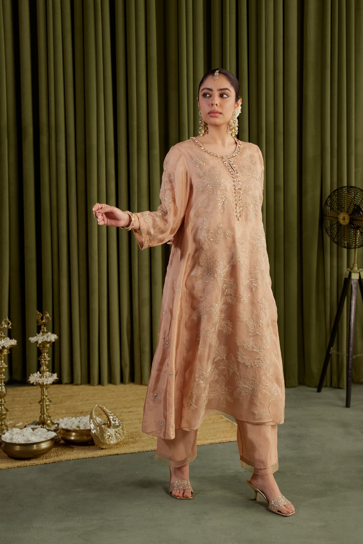 Golden beige kalidar kurta set with delicate floral embroidery.