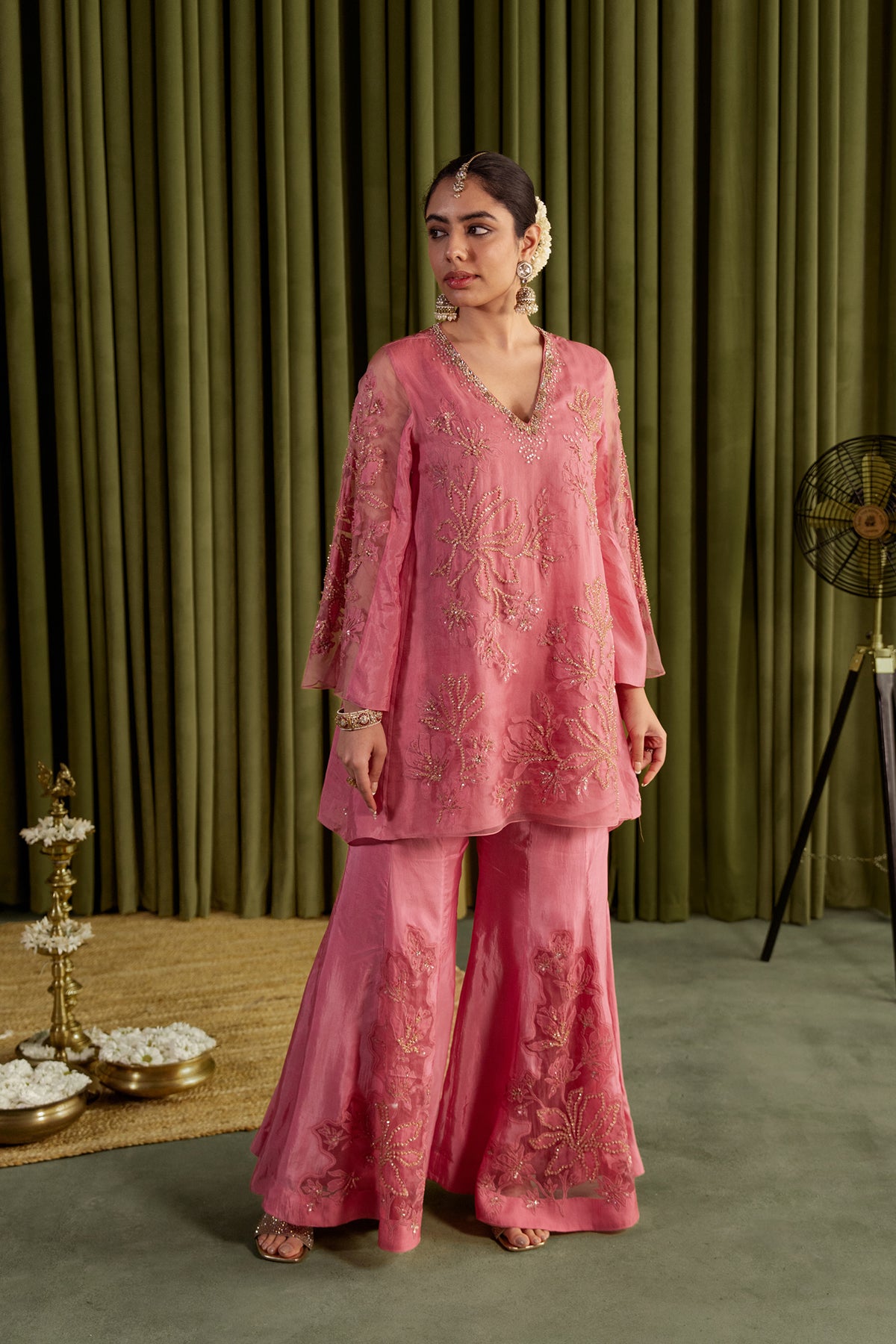 Rose pink sharara set with embroidered magnolia flower pattern.