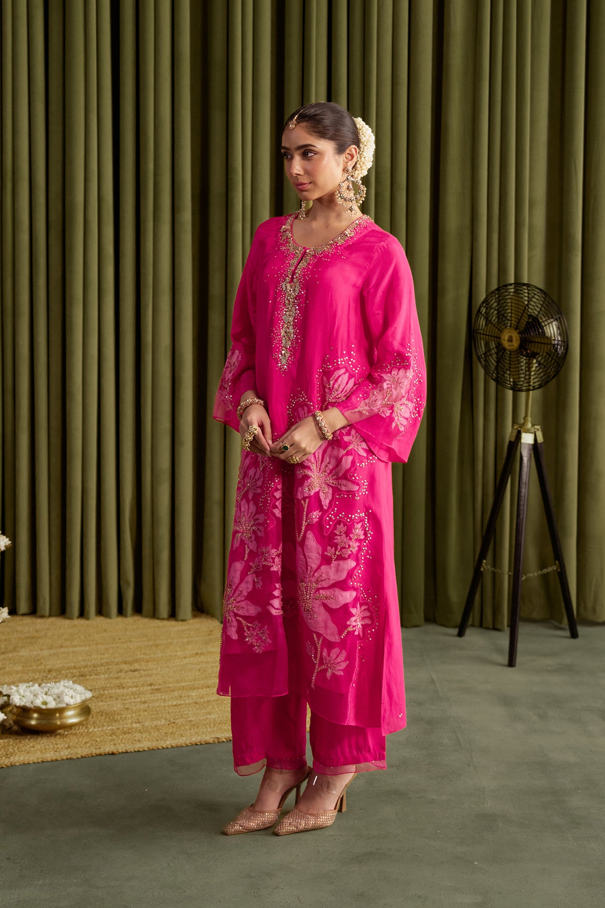 Hot pink kurta set in viscose silk base with embroidered magnolia flower pattern.