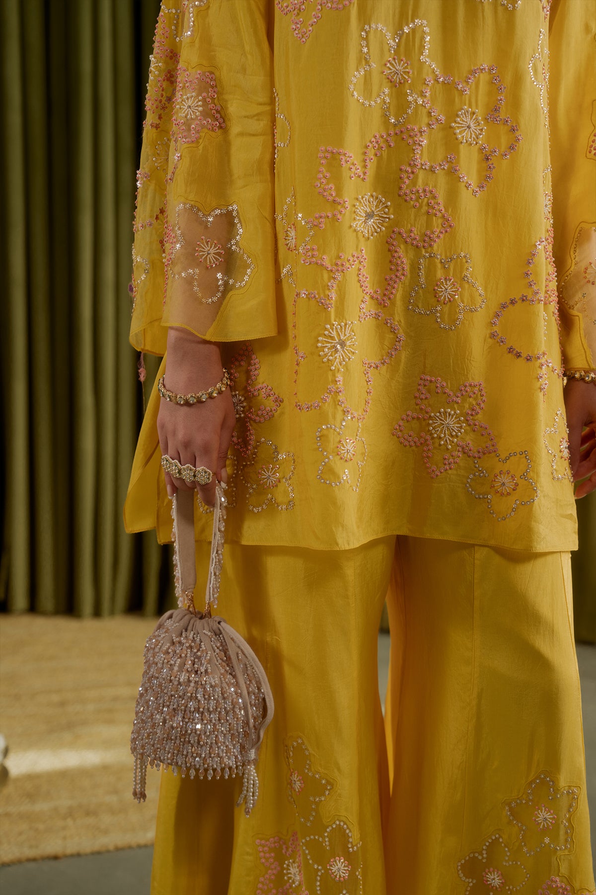 Mango sharara set with hand embroidered floral pattern.