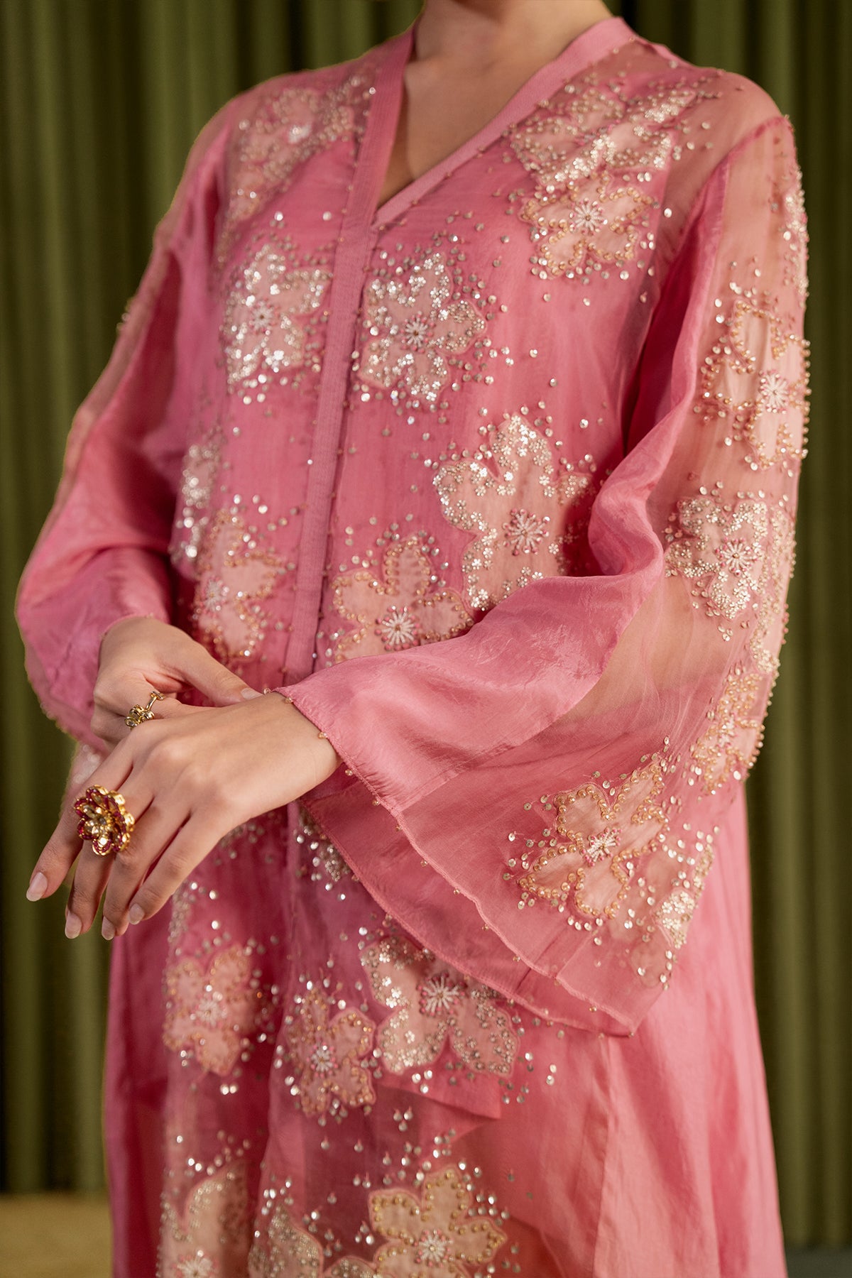 Rose pink co-ord set with embroidered floral pattern.