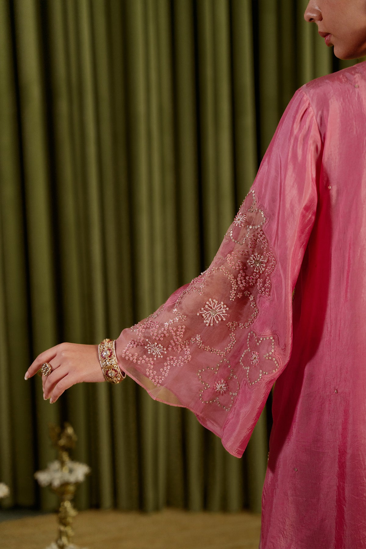 Rose pink sharara set with hand embroidered floral pattern.
