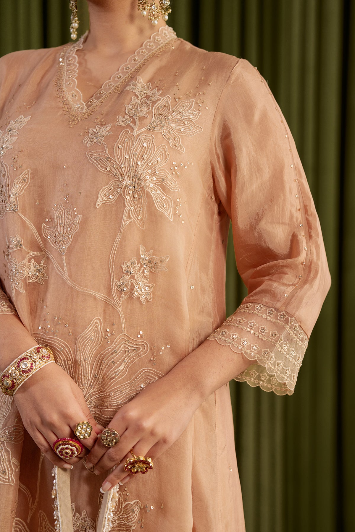 Golden beige kurta set with delicate floral embroidery.
