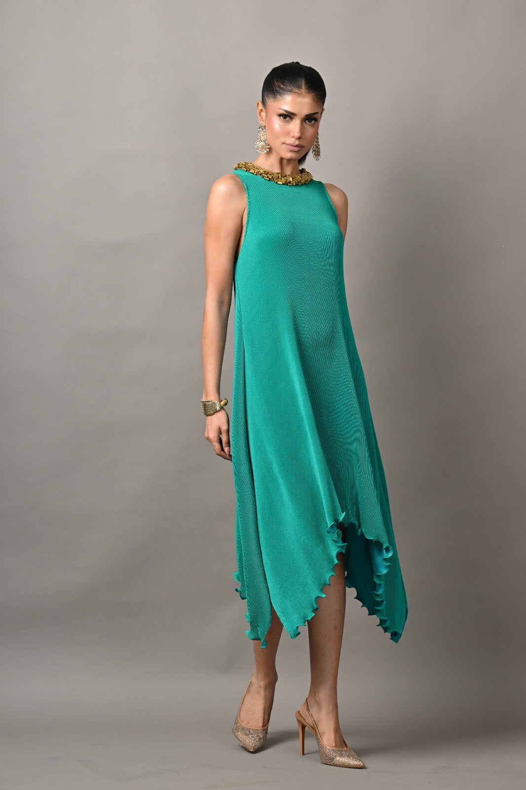 Bright turquoise pleated cutaway dress with gold bricks embroidery