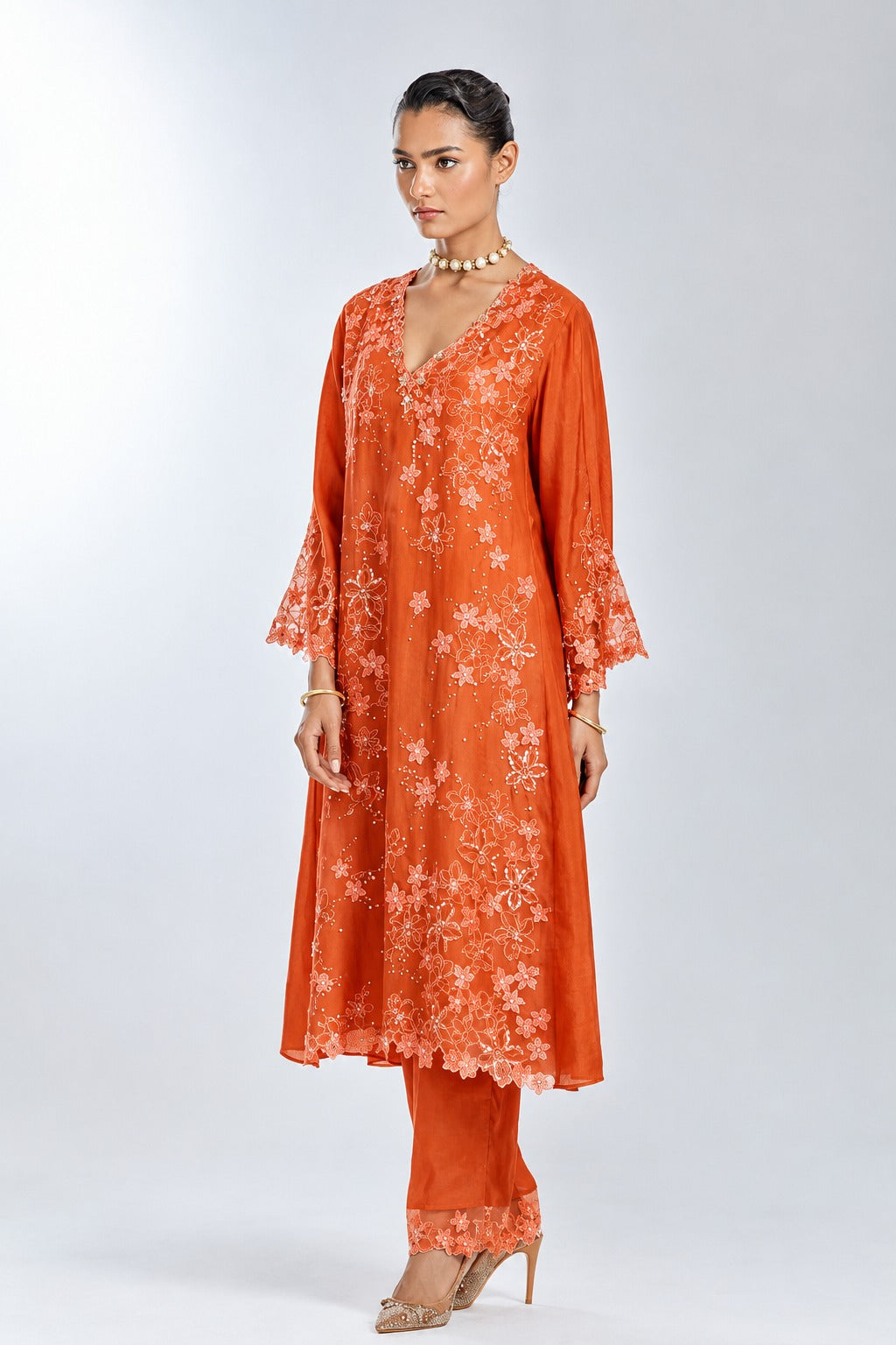 Poppy color A-line silk kurta set with floral thread work