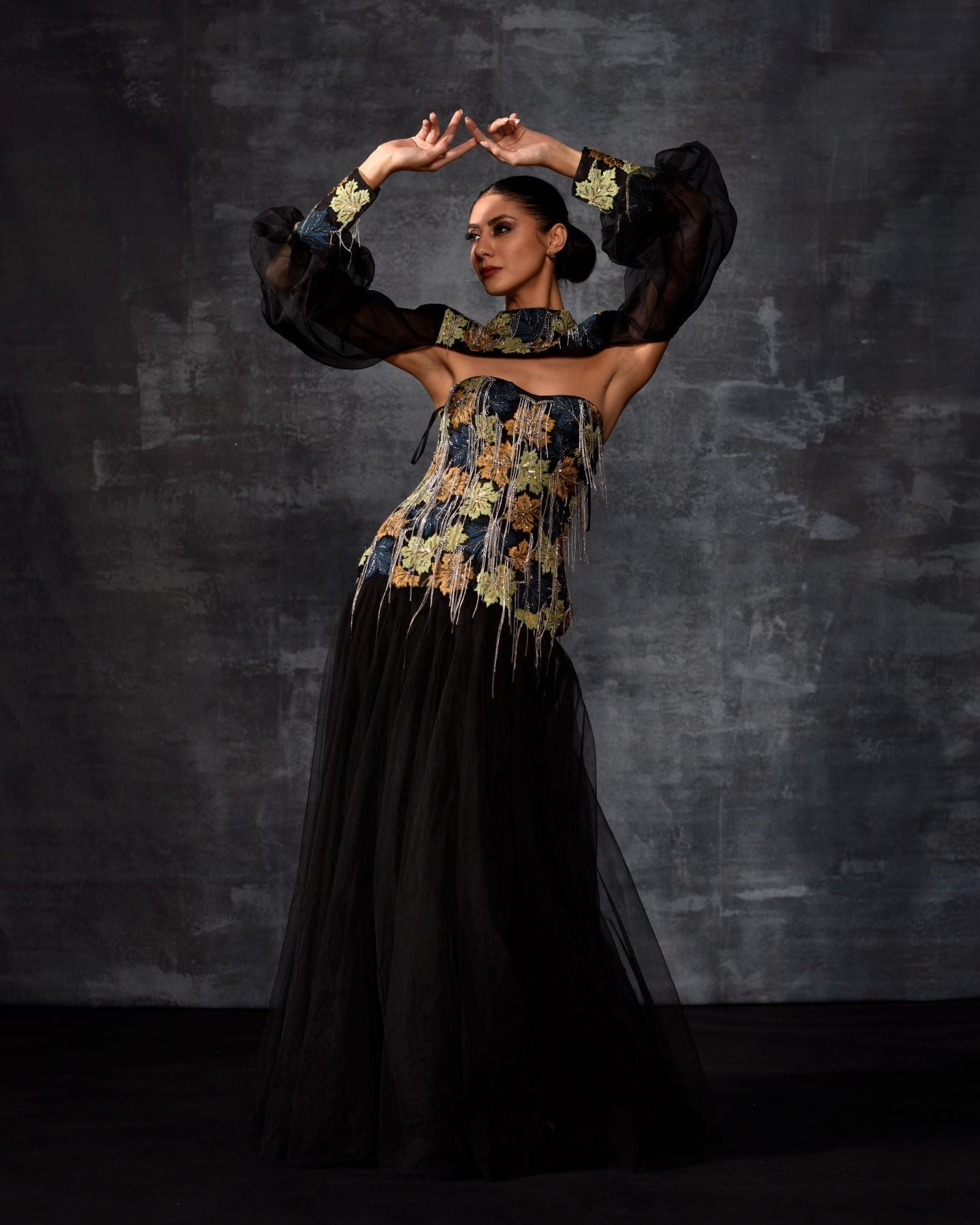 https://cdn.shopify.com/s/files/1/0088/3441/6706/files/a-elegant-black-off-shoulder-gown-features-a-dramatic-sleeve-top-6286664.jpg?v=1752388530