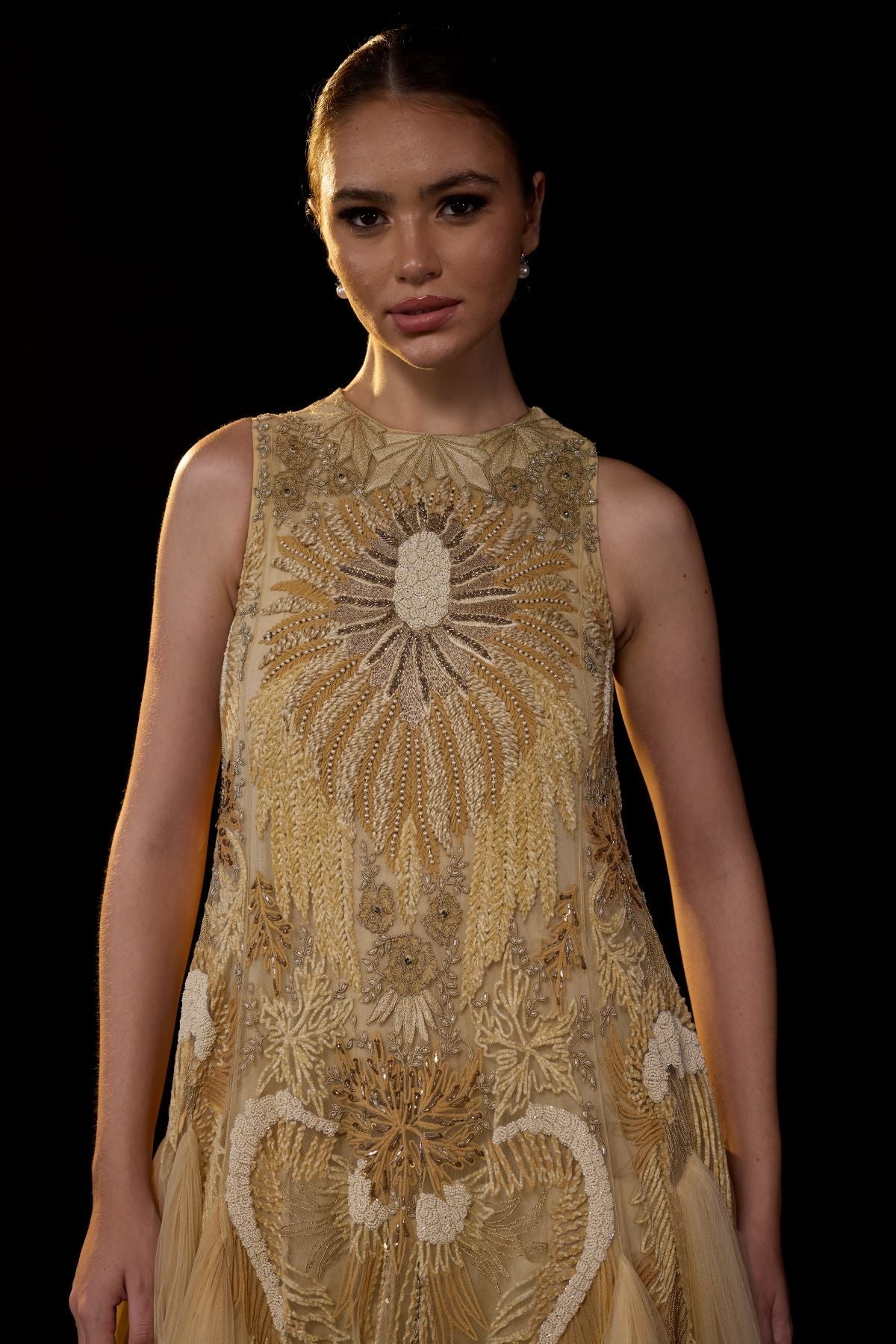 https://cdn.shopify.com/s/files/1/0088/3441/6706/files/a-ethereal-beige-gown-features-a-sleeveless-tier-ghera-5056793.jpg?v=1752388531
