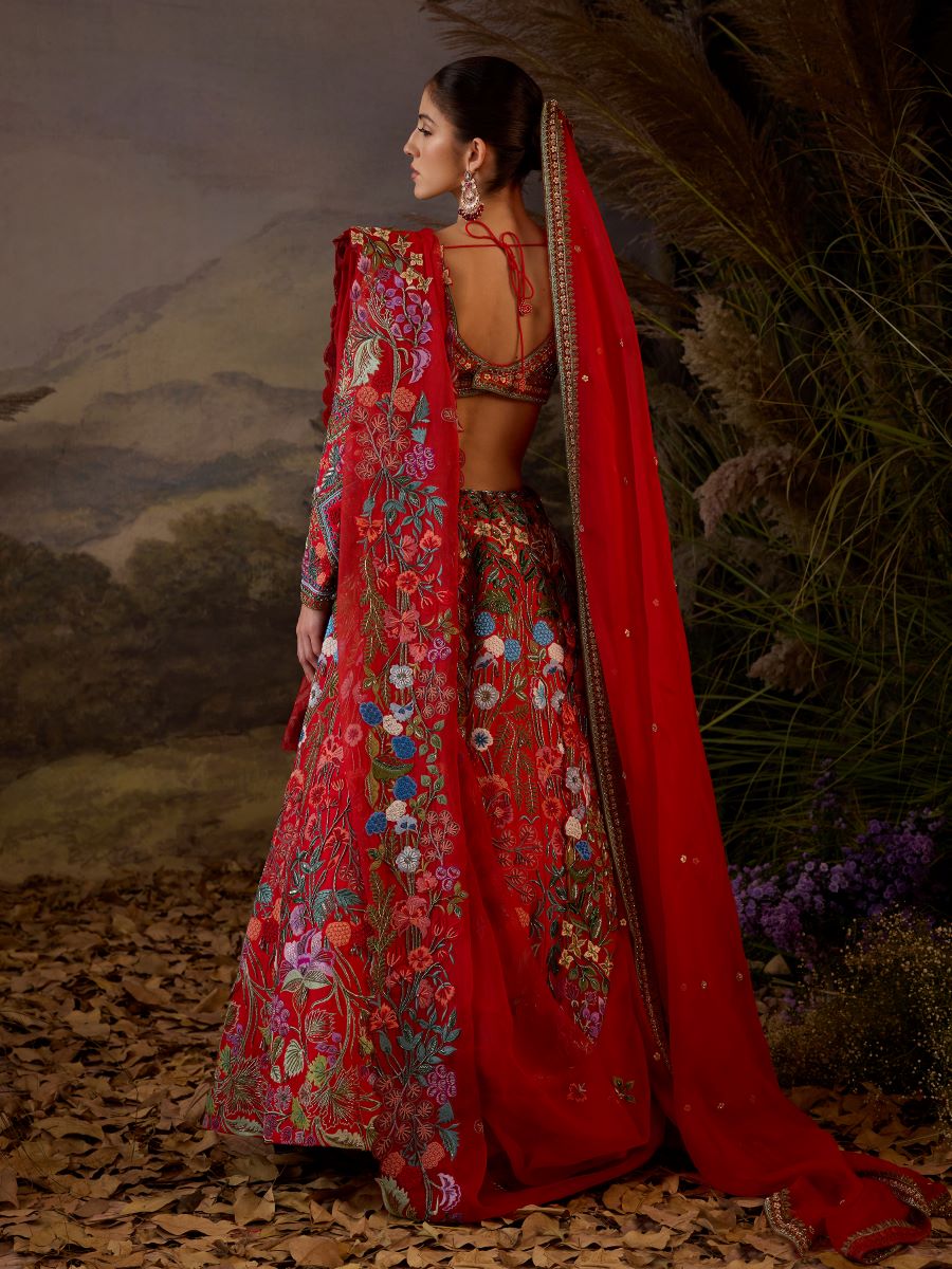 https://cdn.shopify.com/s/files/1/0088/3441/6706/files/a-red-organza-cotton-silk-lengha-with-v-neck-line-8596067.jpg?v=1752388669