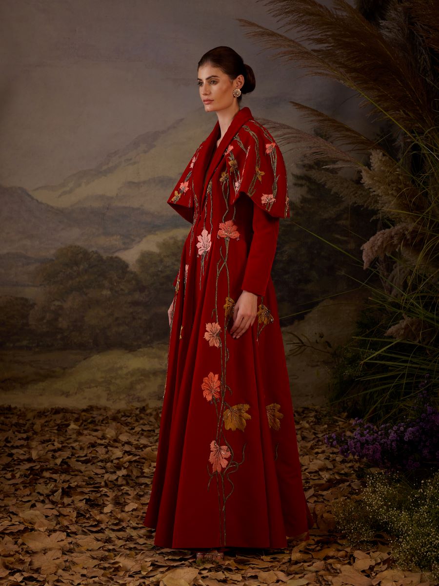 https://cdn.shopify.com/s/files/1/0088/3441/6706/files/a-red-velvet-fabric-floor-length-gown-with-lapel-neck-line-extended-cape-8037057.jpg?v=1752388666
