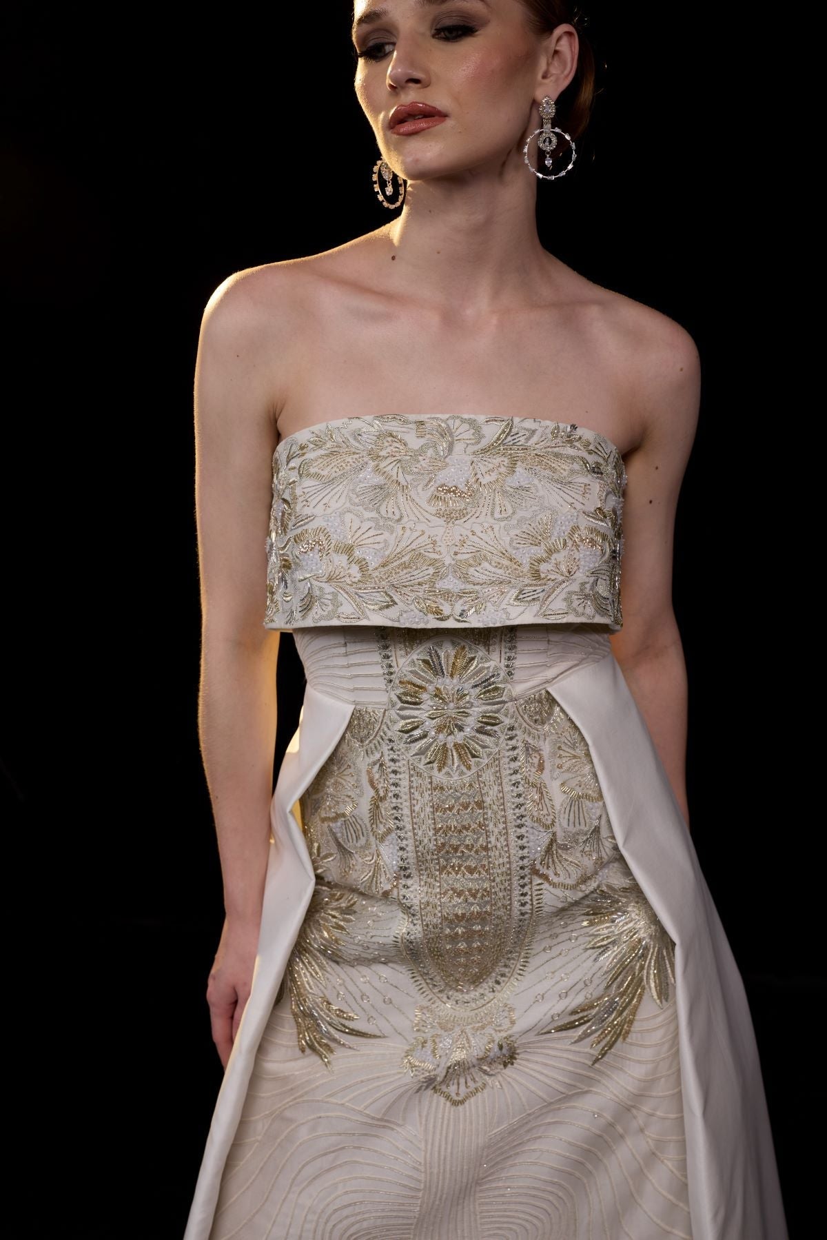 https://cdn.shopify.com/s/files/1/0088/3441/6706/files/a-sophisticated-strapless-gown-showcases-intricate-gold-embroidery-9446677.jpg?v=1752388529