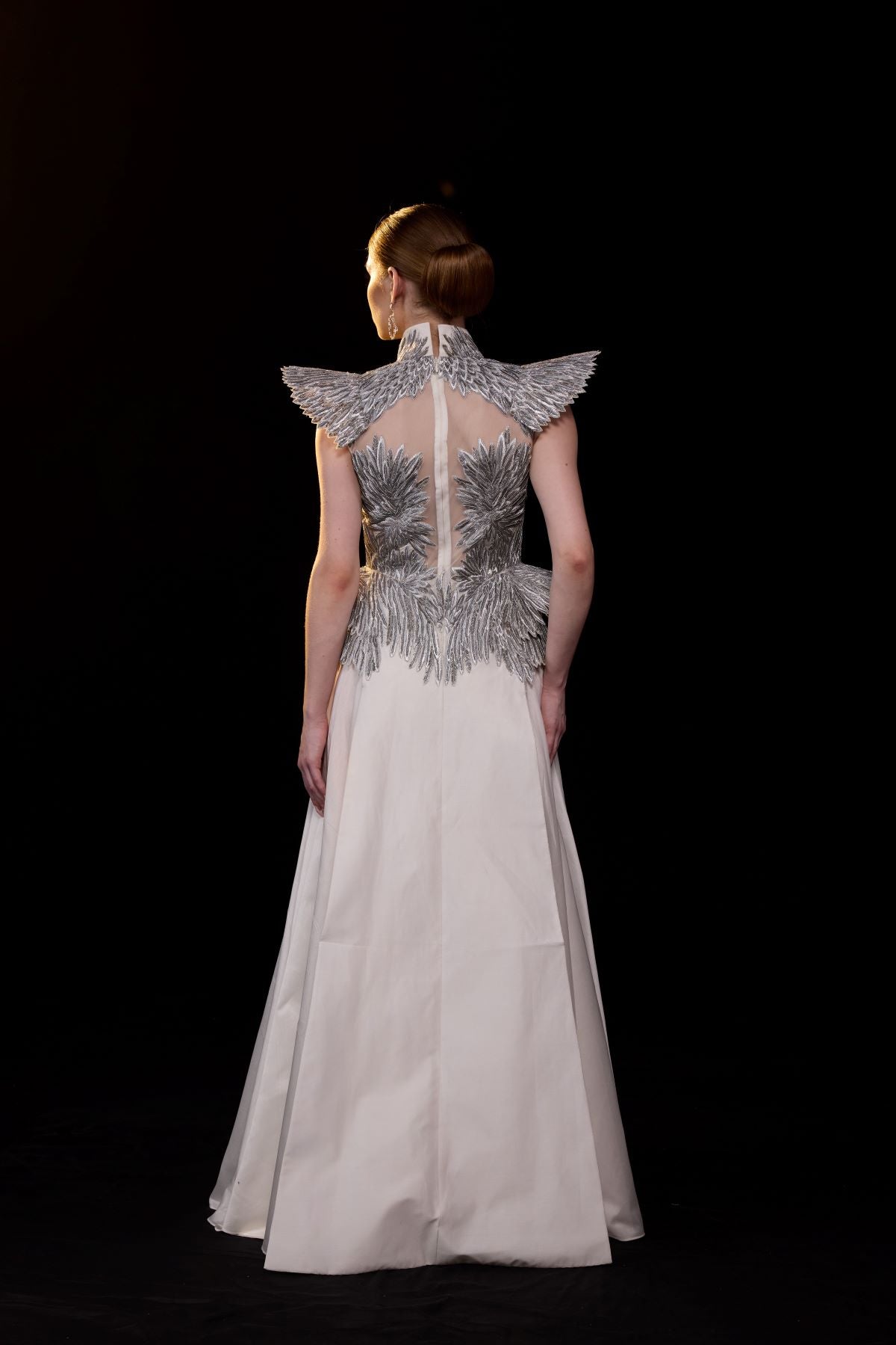 https://cdn.shopify.com/s/files/1/0088/3441/6706/files/a-striking-evening-gown-featuring-a-sculptural-6799876.jpg?v=1752388529