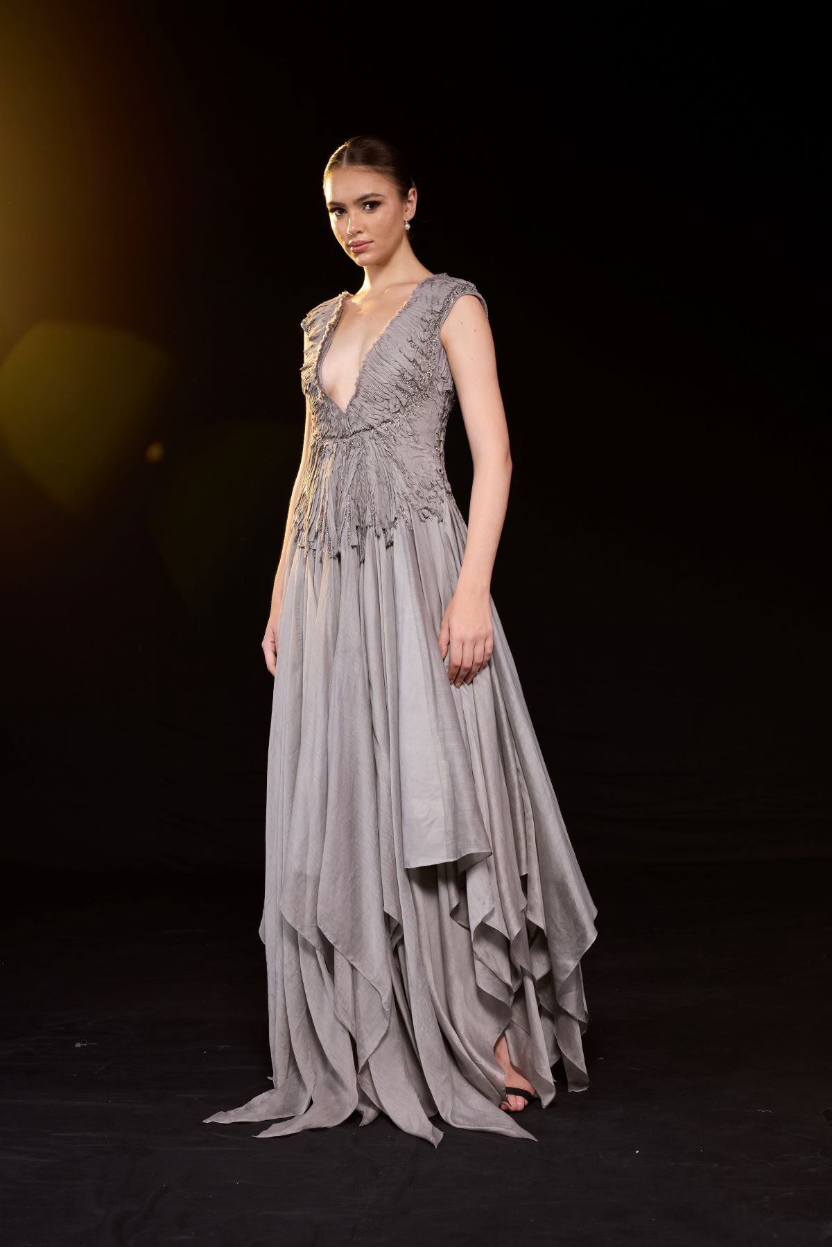 https://cdn.shopify.com/s/files/1/0088/3441/6706/files/a-striking-grey-gown-features-a-deep-v-neckline-and-delicately-ruched-bodice-2605649.jpg?v=1752388531