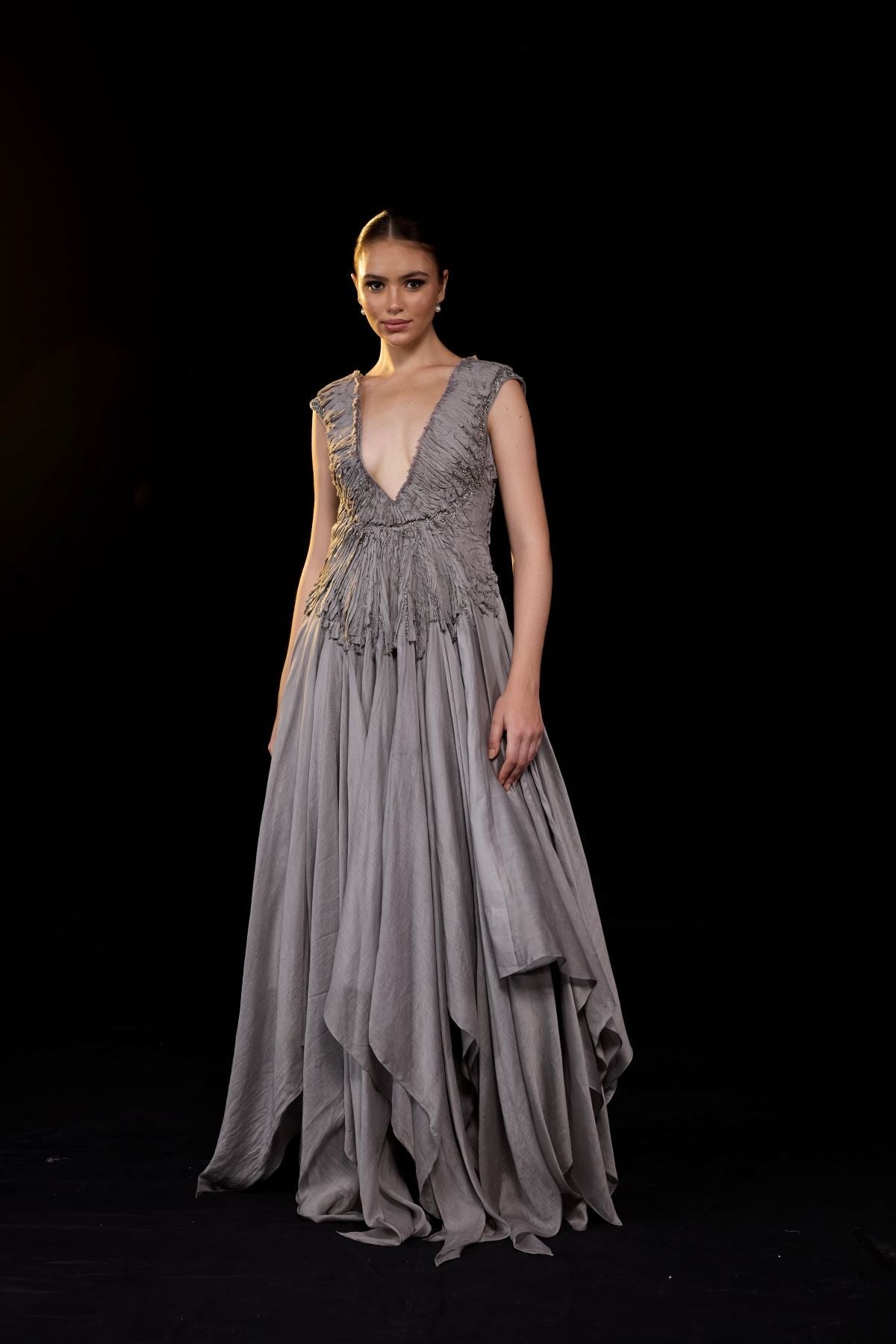 https://cdn.shopify.com/s/files/1/0088/3441/6706/files/a-striking-grey-gown-features-a-deep-v-neckline-and-delicately-ruched-bodice-7781914.jpg?v=1752388531