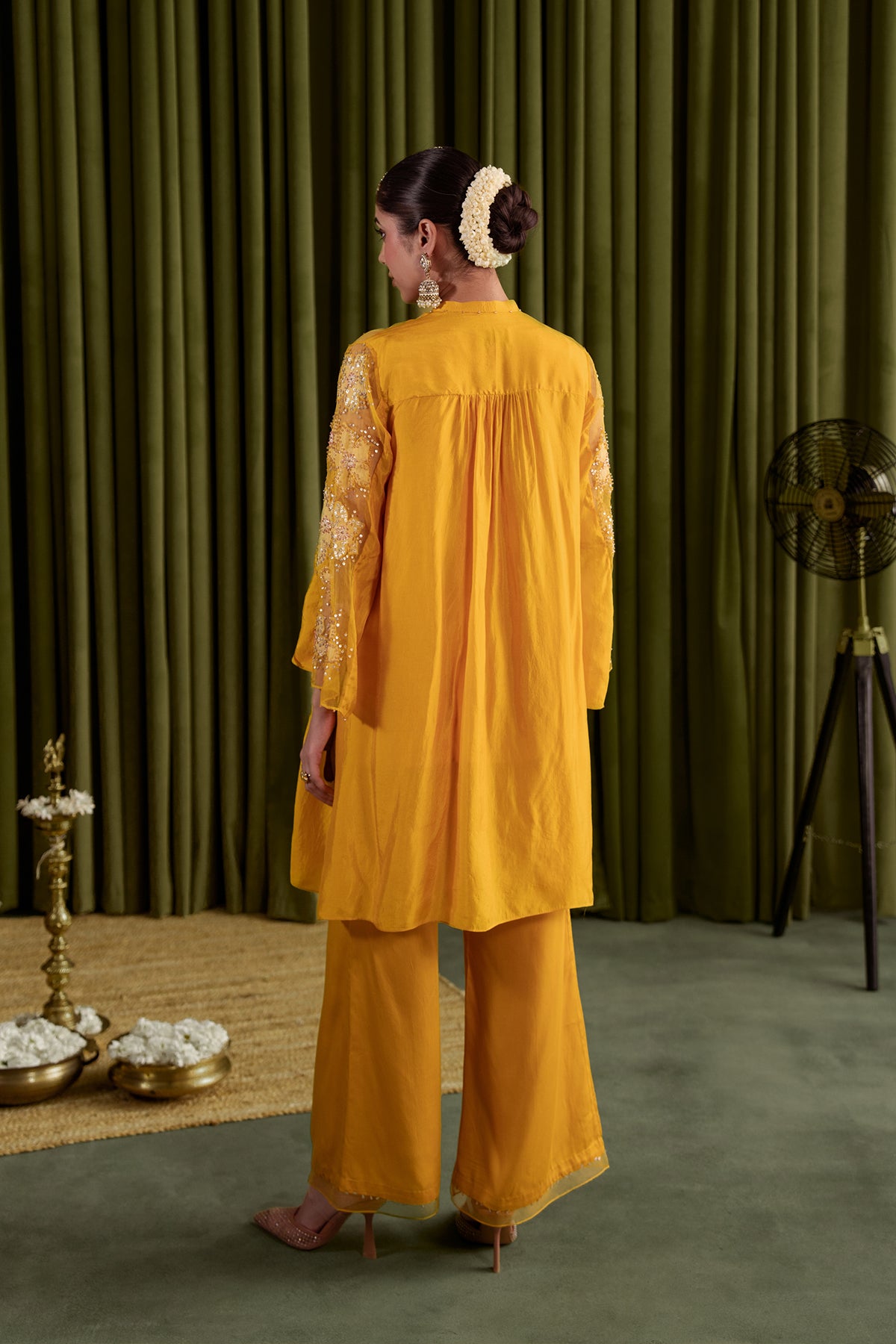 Golden beige co-ord set with embroidered floral pattern.