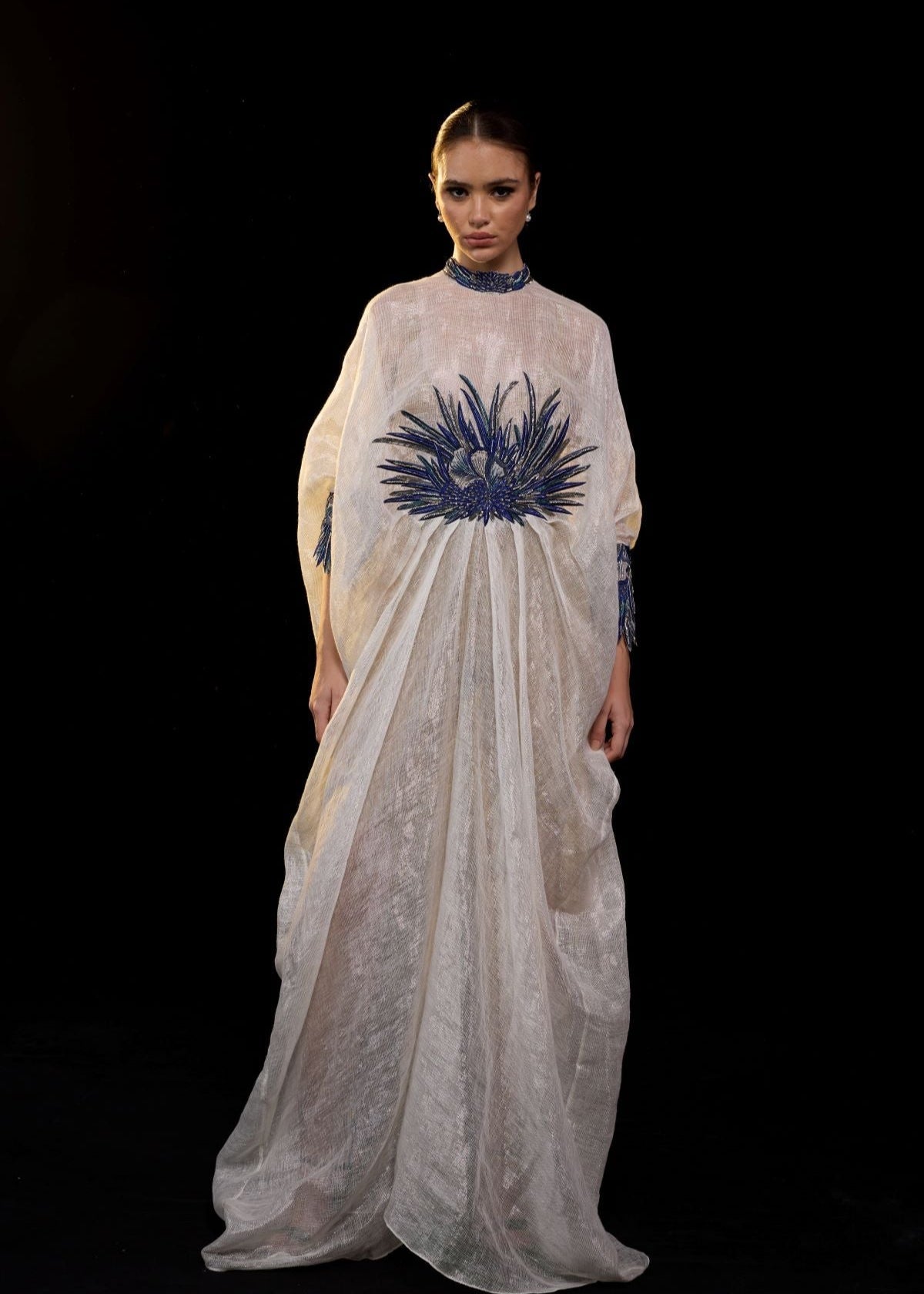 https://cdn.shopify.com/s/files/1/0088/3441/6706/files/ivory-draped-gown-with-blue-embroidery-5232868.jpg?v=1752388529