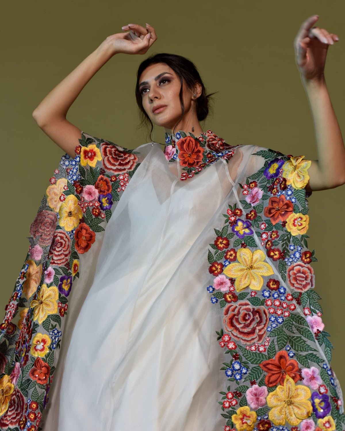 https://cdn.shopify.com/s/files/1/0088/3441/6706/files/ivory-silk-gown-with-bold-floral-embroidered-cape-1067498.jpg?v=1752388608