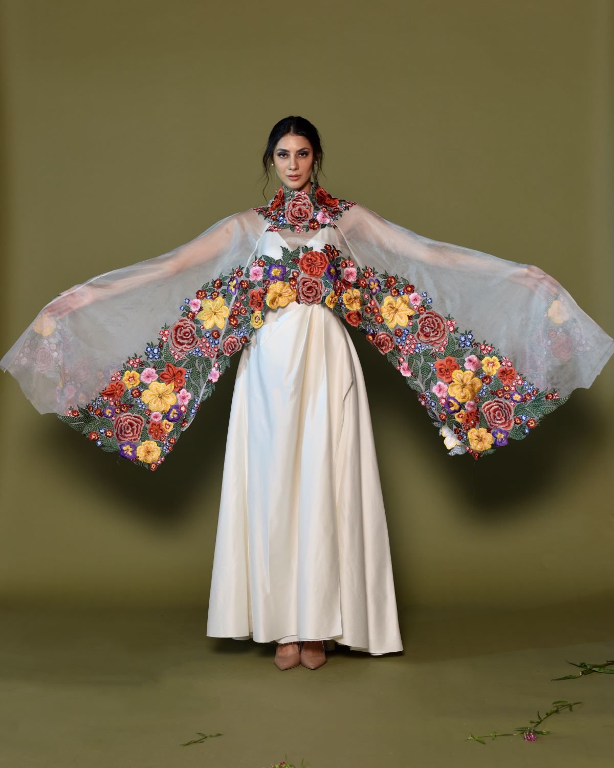 https://cdn.shopify.com/s/files/1/0088/3441/6706/files/ivory-silk-gown-with-bold-floral-embroidered-cape-1926525.jpg?v=1752388608