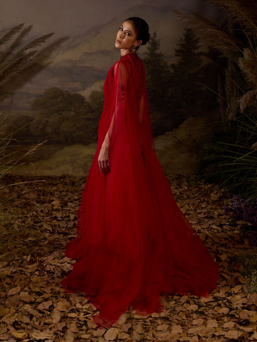 https://cdn.shopify.com/s/files/1/0088/3441/6706/files/red-gown-featuring-pleating-textured-details-8079993.jpg?v=1752388662
