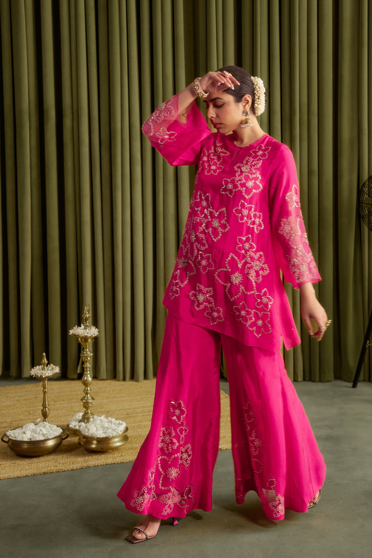 Hot pink sharara set with hand embroidered floral pattern.
