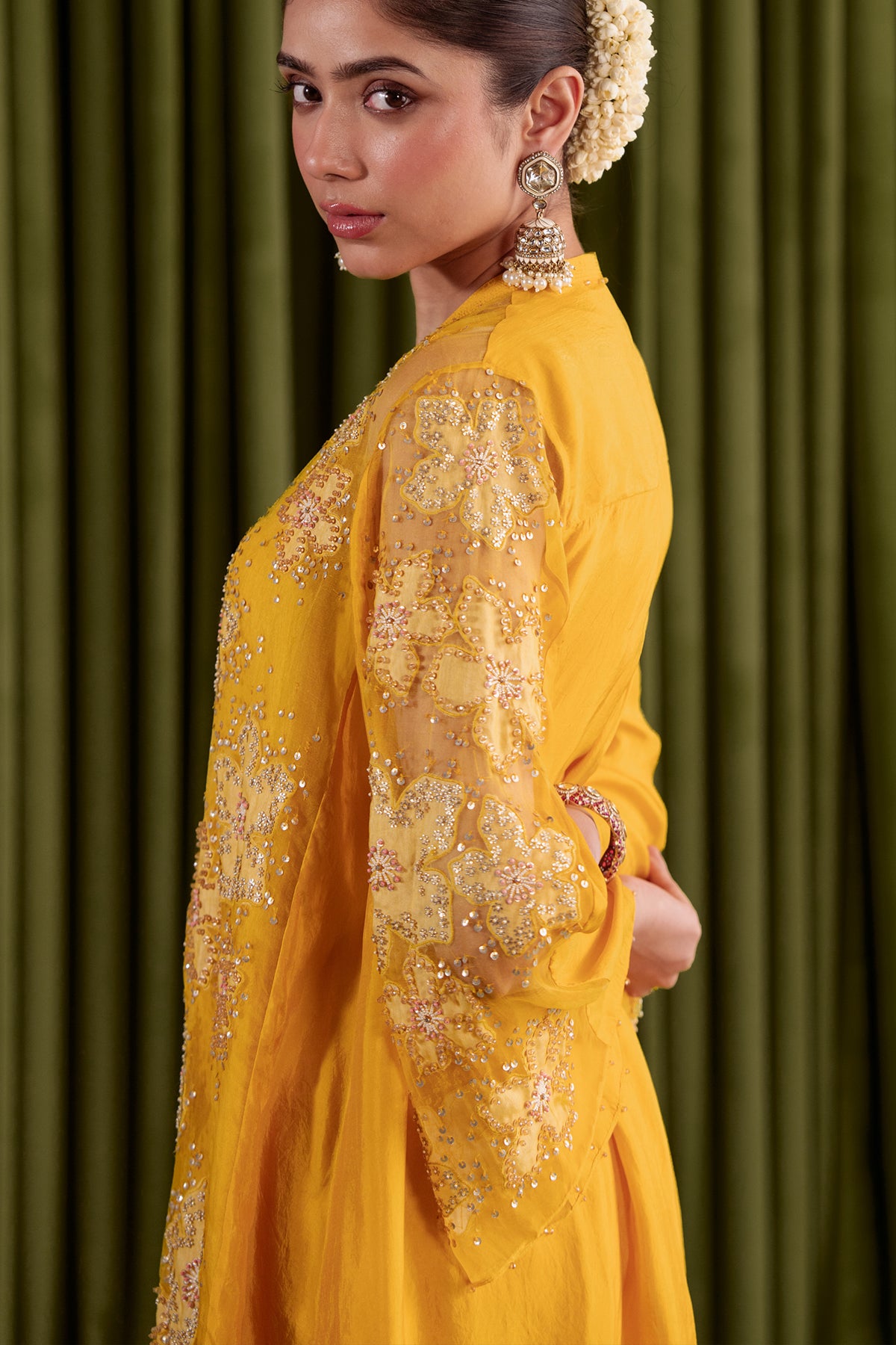 Golden beige co-ord set with embroidered floral pattern.