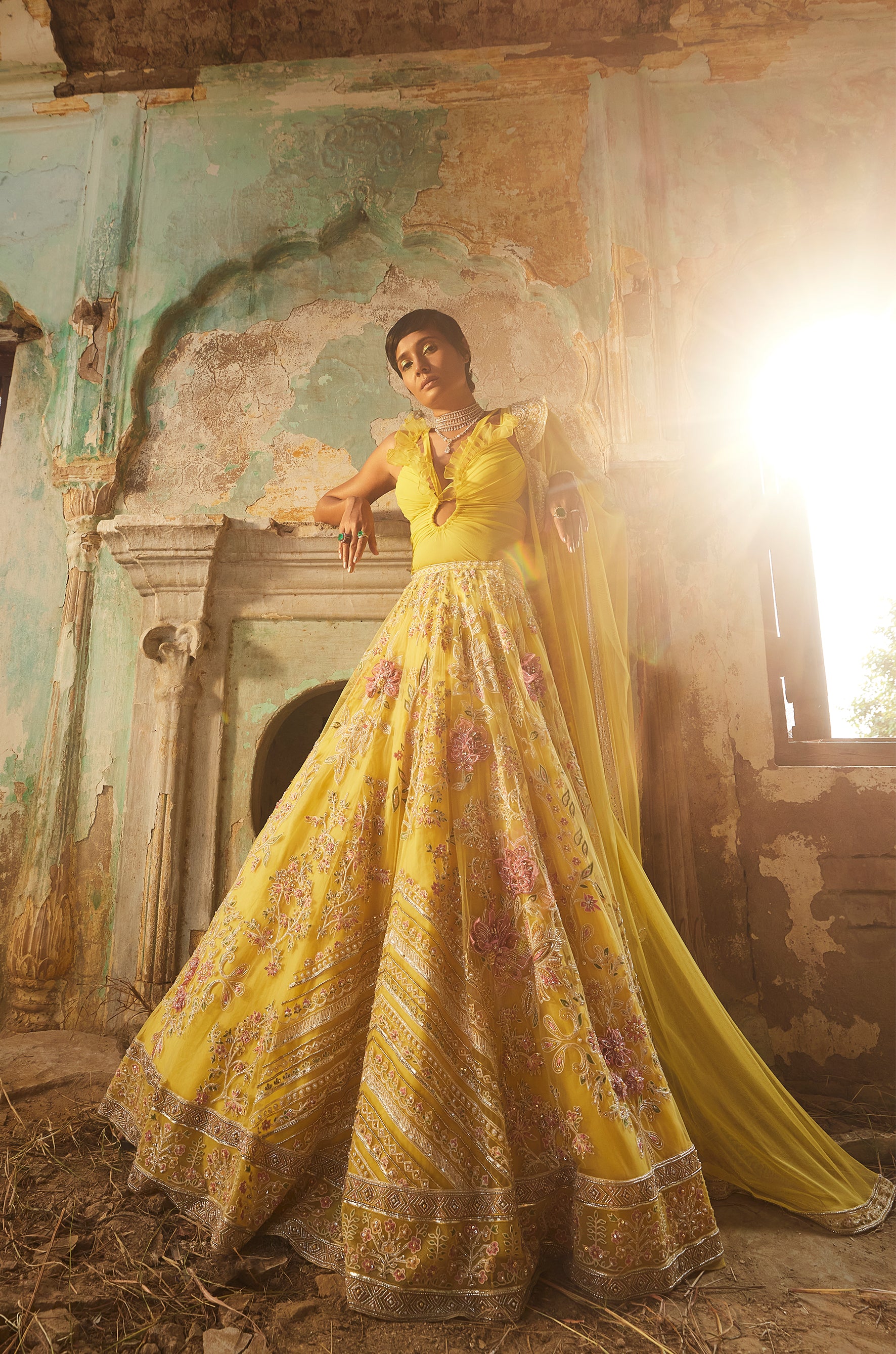 Yellow georgette ruffled bodysuit with net embroidered lehenga